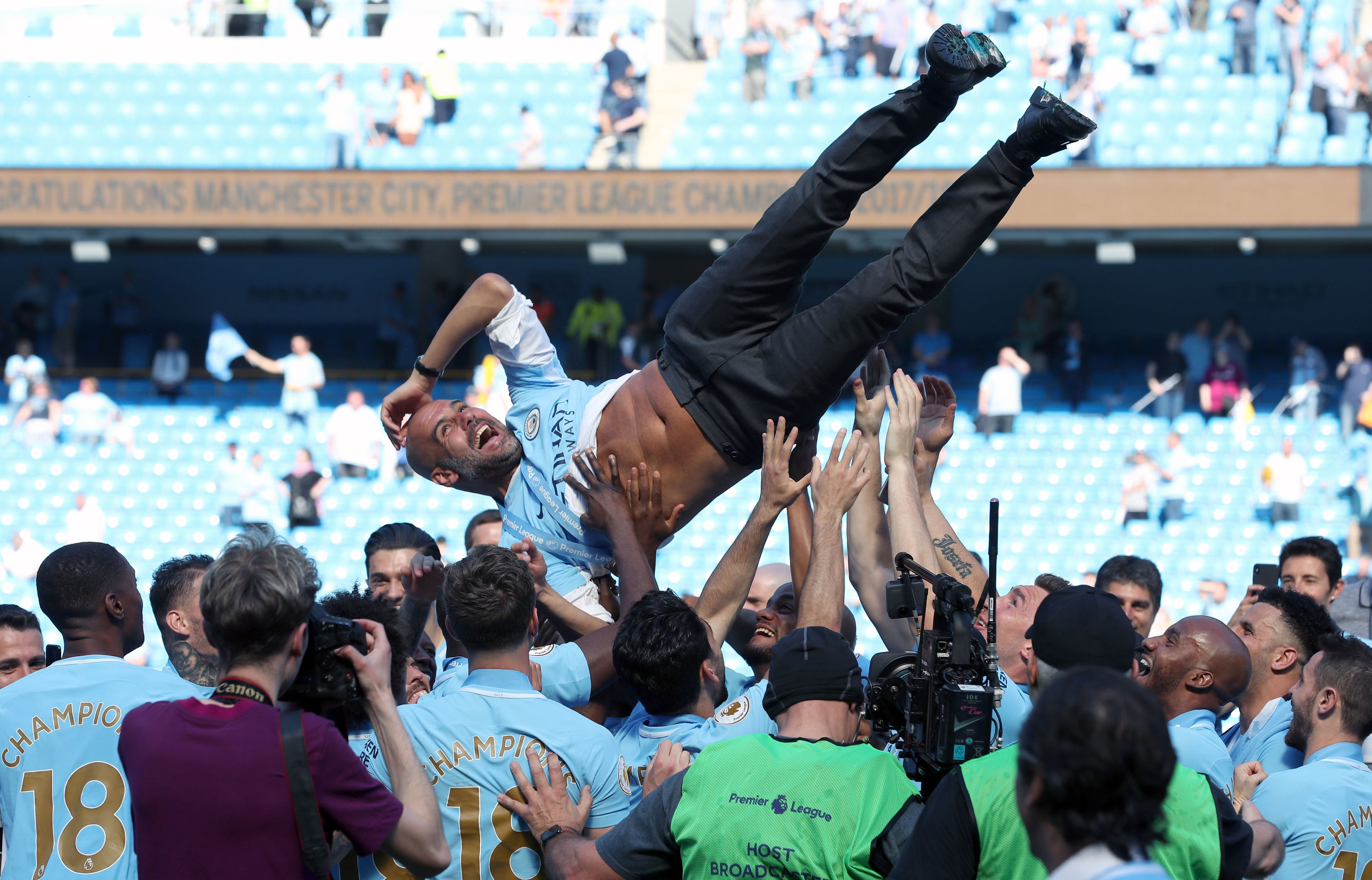 Manchester City manager Pep Guardiola is thrown up into the air by players during the Premier League trophy celebrations (Martin Rickett/PA Wire)