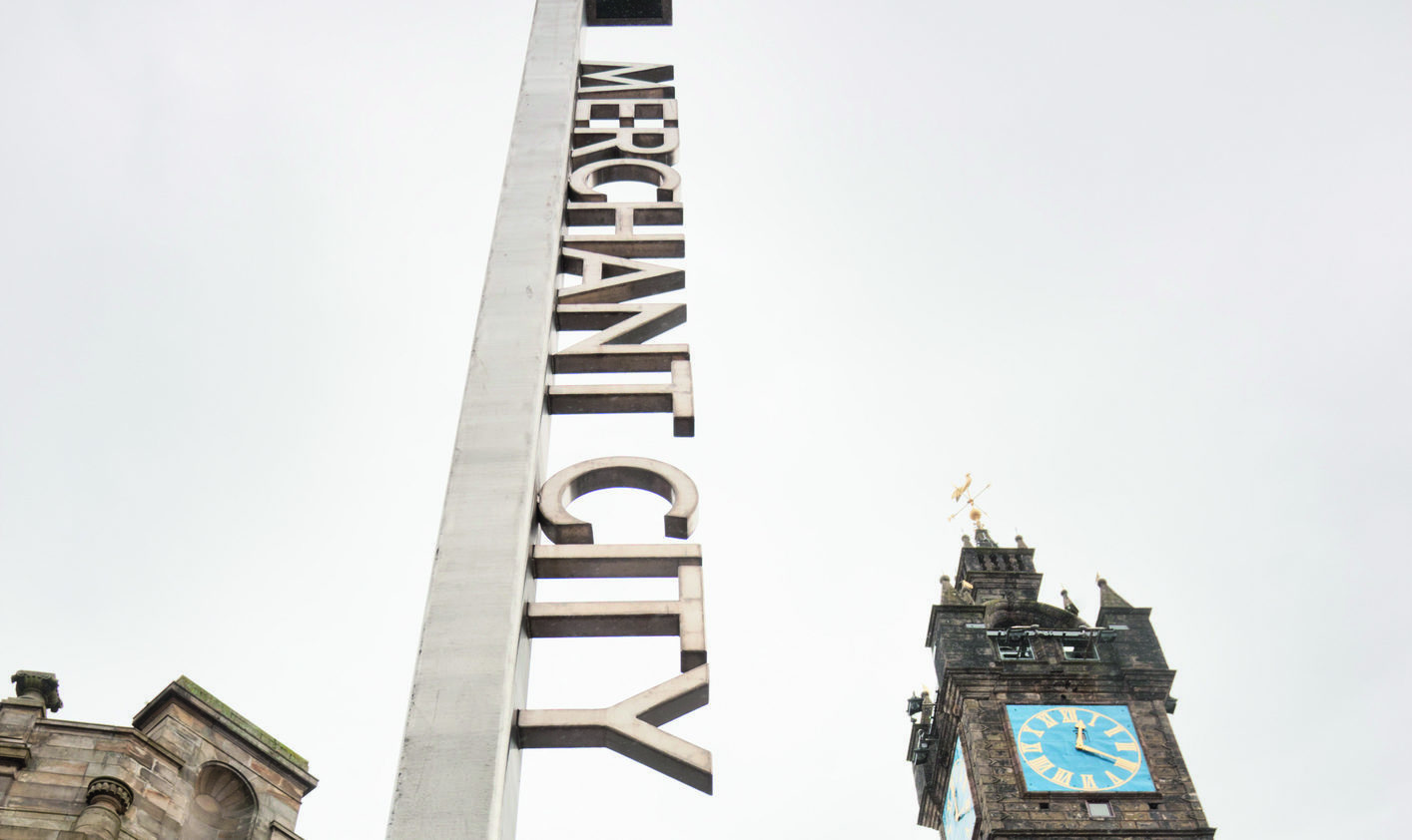 The Tollbooth Steeple tower and district name sign in the Merchant City district (Martin McCarthy / Getty Images)