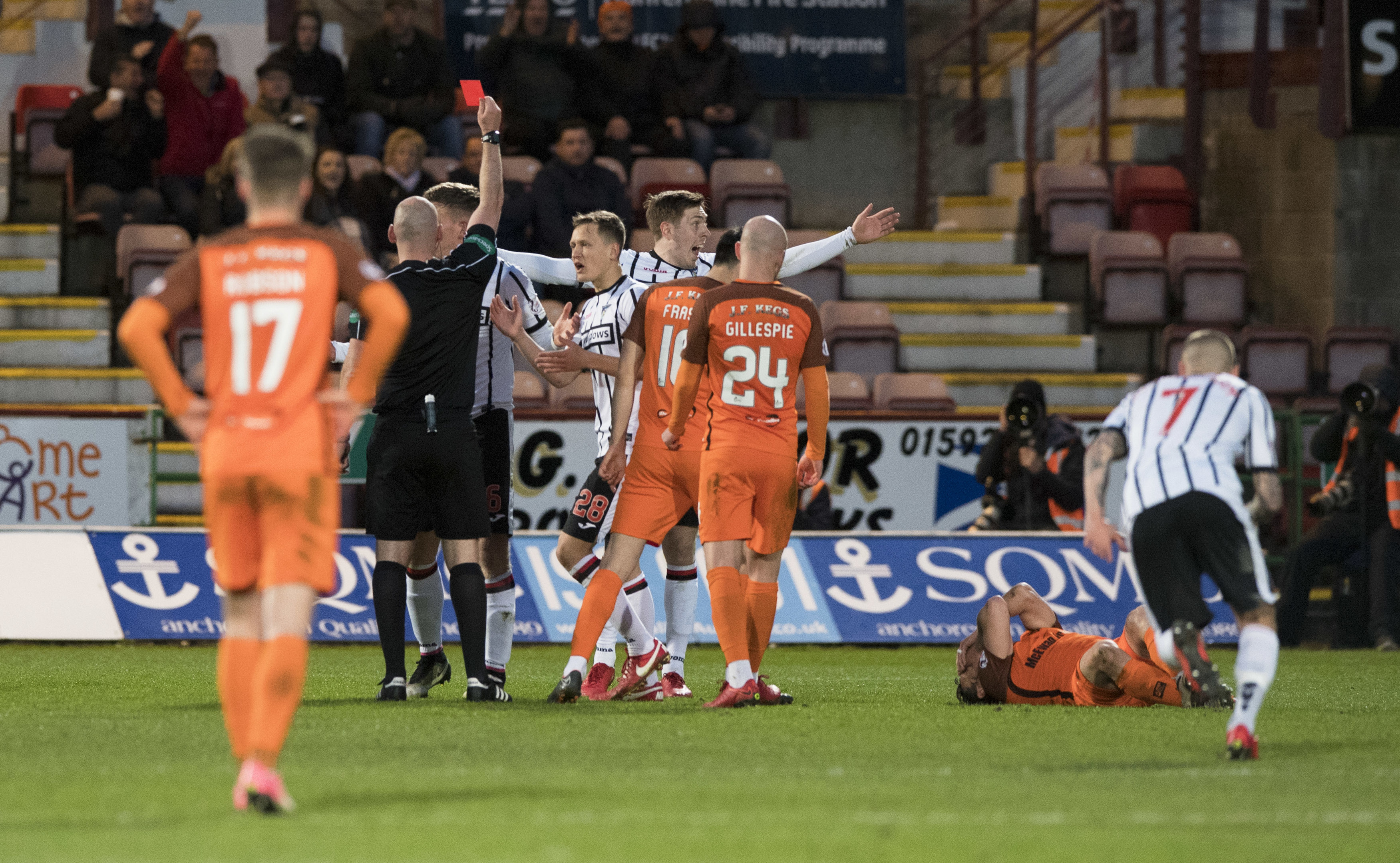 Dunfermline's Lee Ashcroft is sent off by referee Bobby Madden (centre) after a foul on Dundee United's Scott McDonald (R) (SNS Group / Alan Harvey)