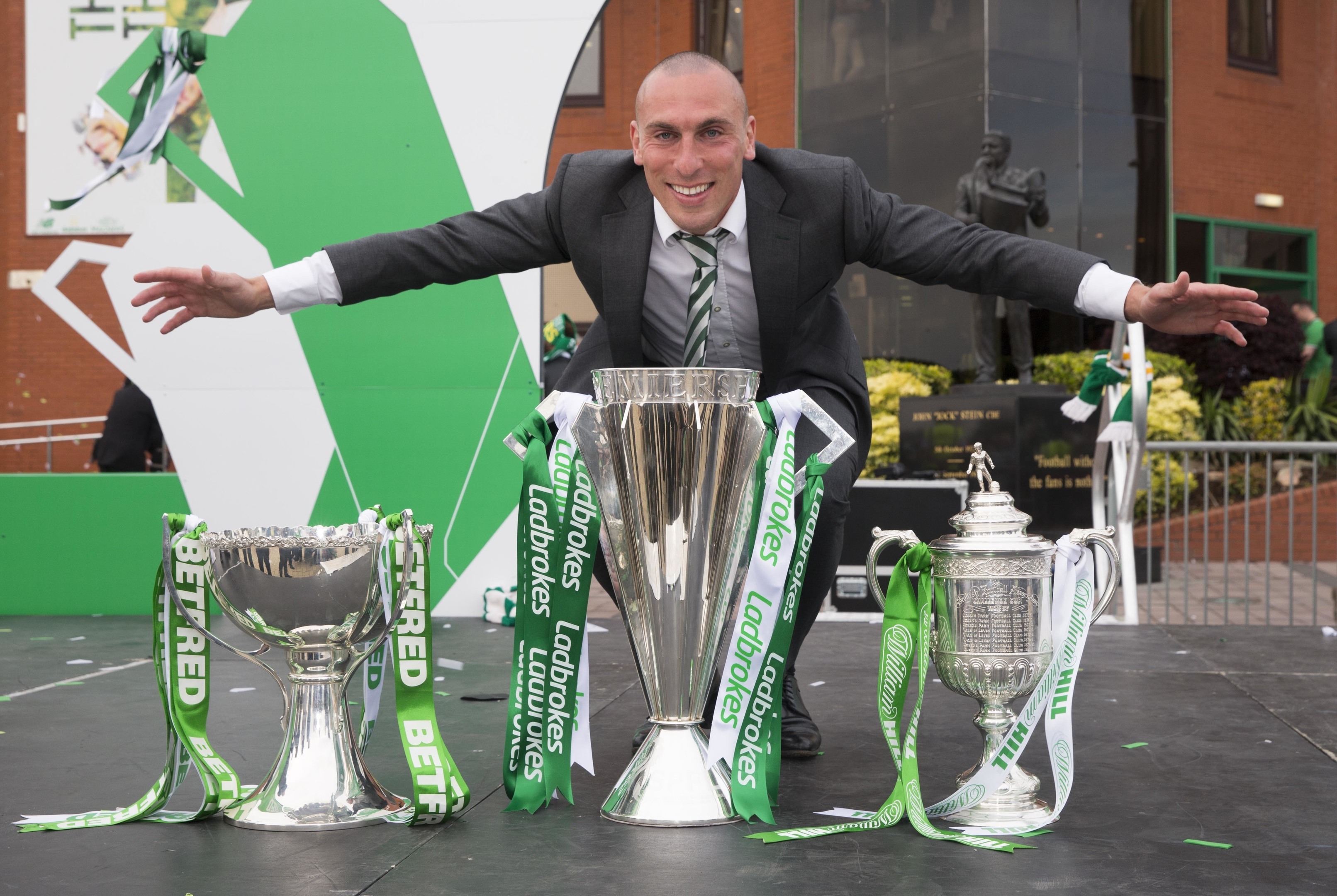 Scott Brown poses with the trophies during a parade at Celtic Park (Jeff Holmes/PA Wire)