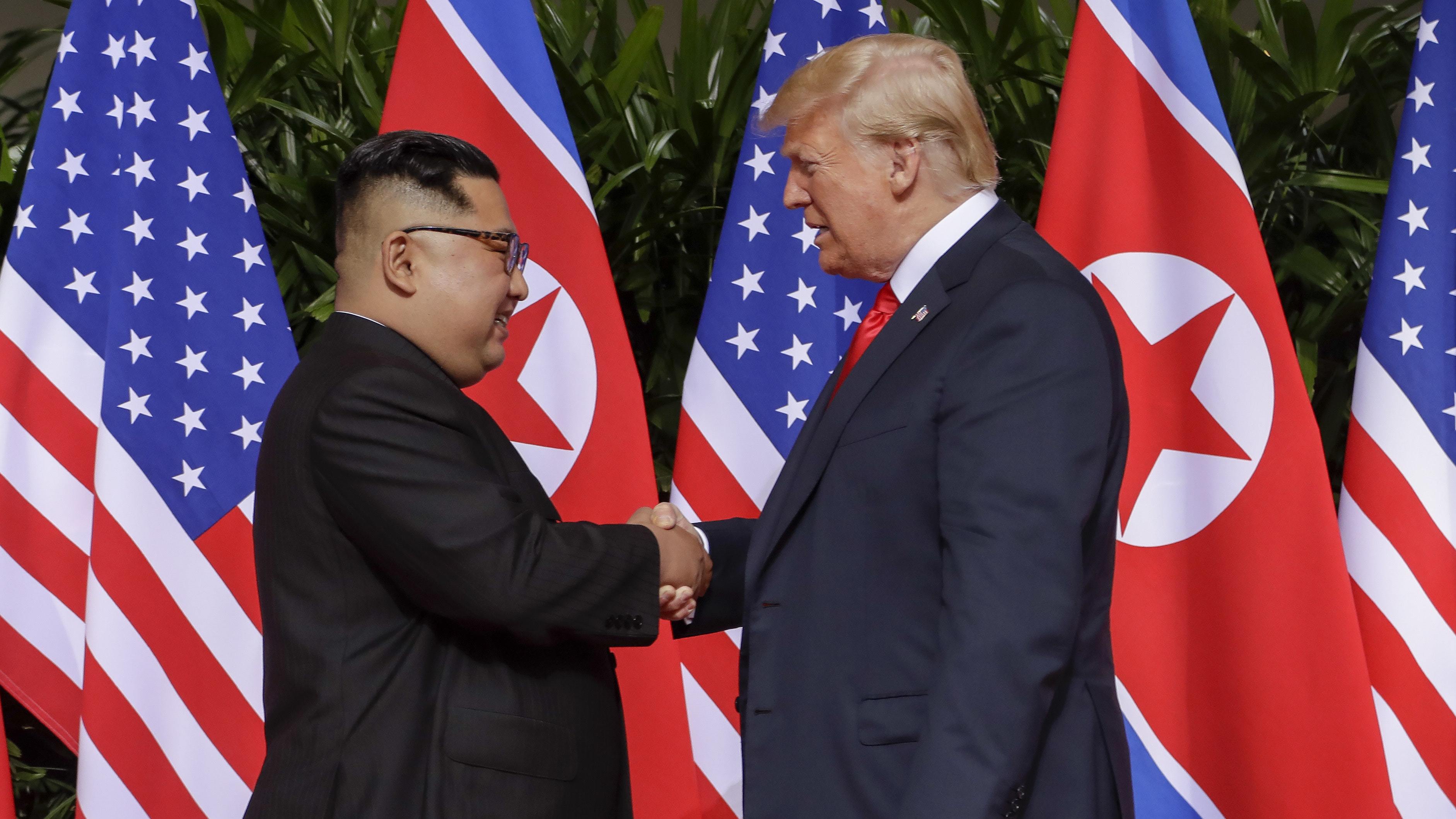 Kim and Trump shake hands