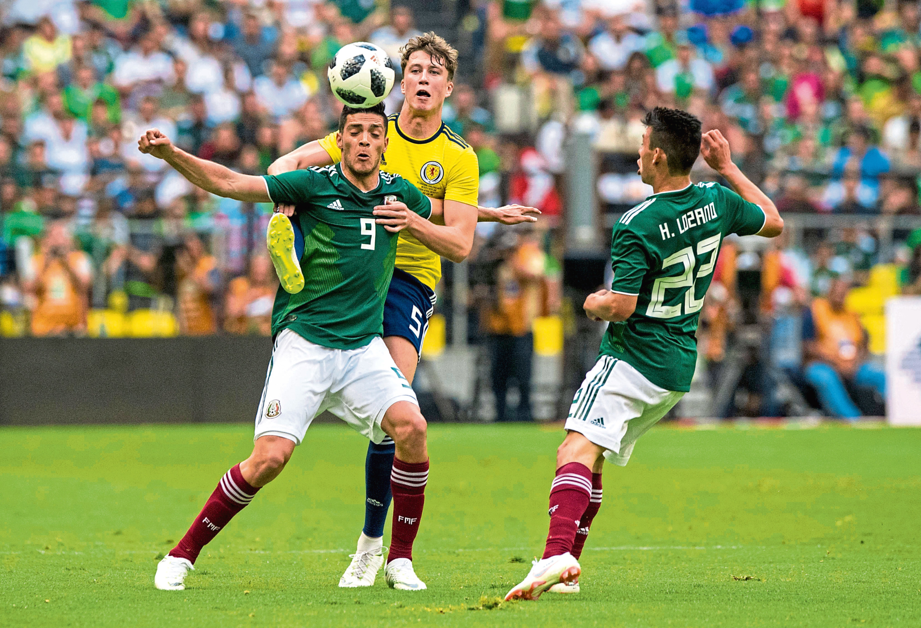 Scotland's Jack Hendry (right) competes with Mexico's Raul Jimenez in a recent friendly (SNS Group / Alan Harvey)