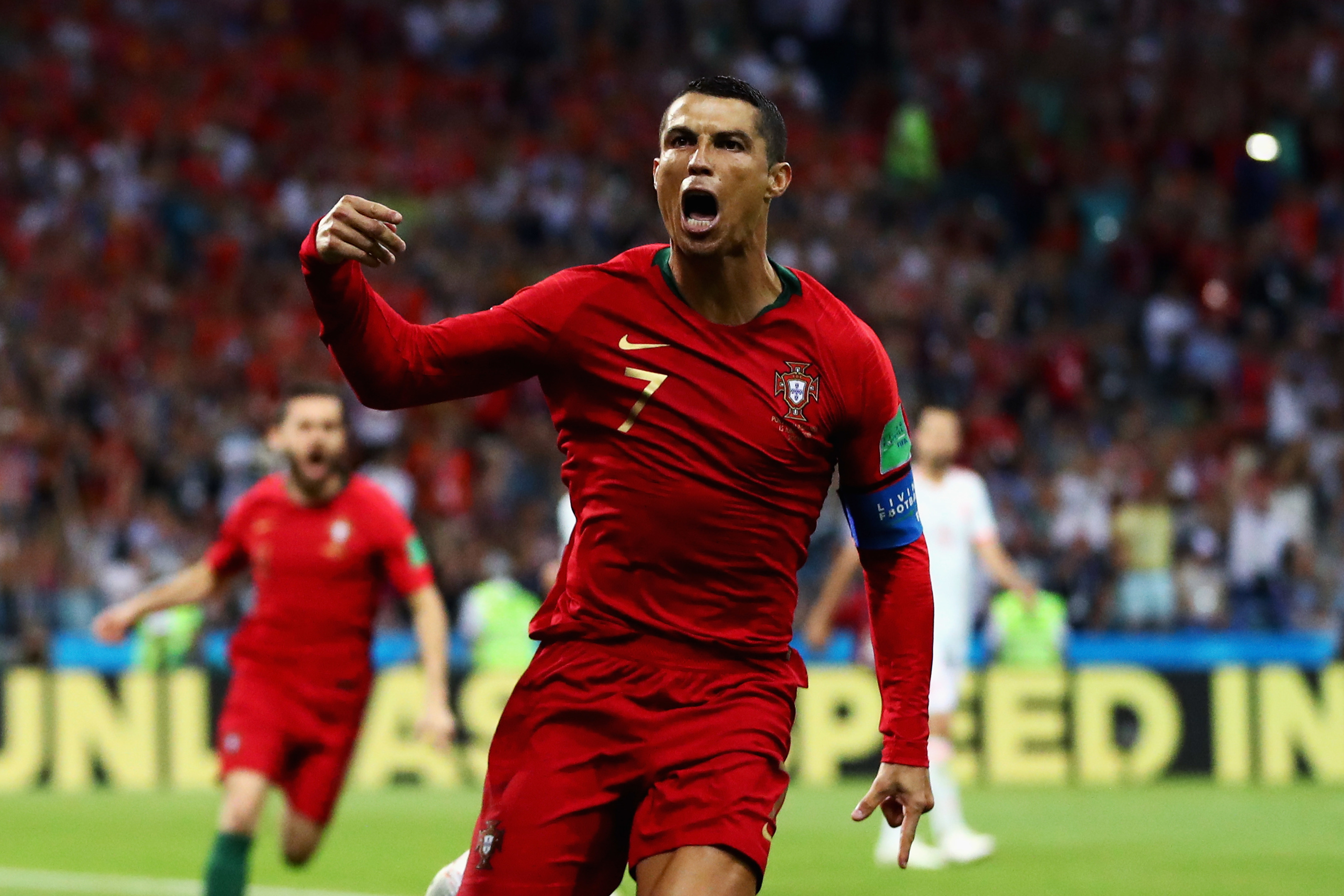Cristiano Ronaldo celebrates after scoring against Spain (Dean Mouhtaropoulos/Getty Images)