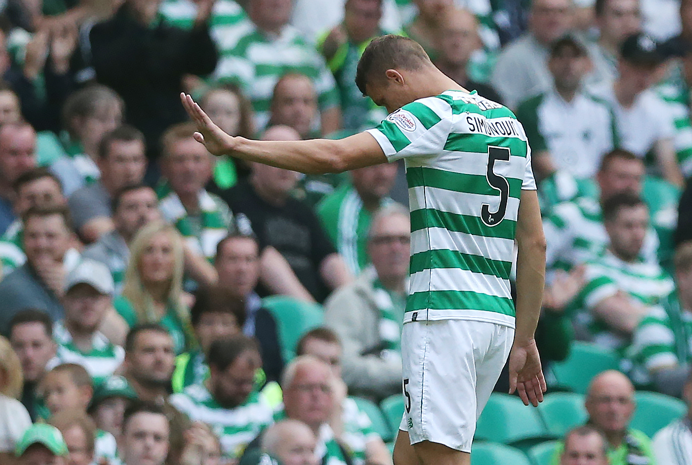 Jozo Simunovic walks off the pitch after being red carded (Ian MacNicol/Getty Images)