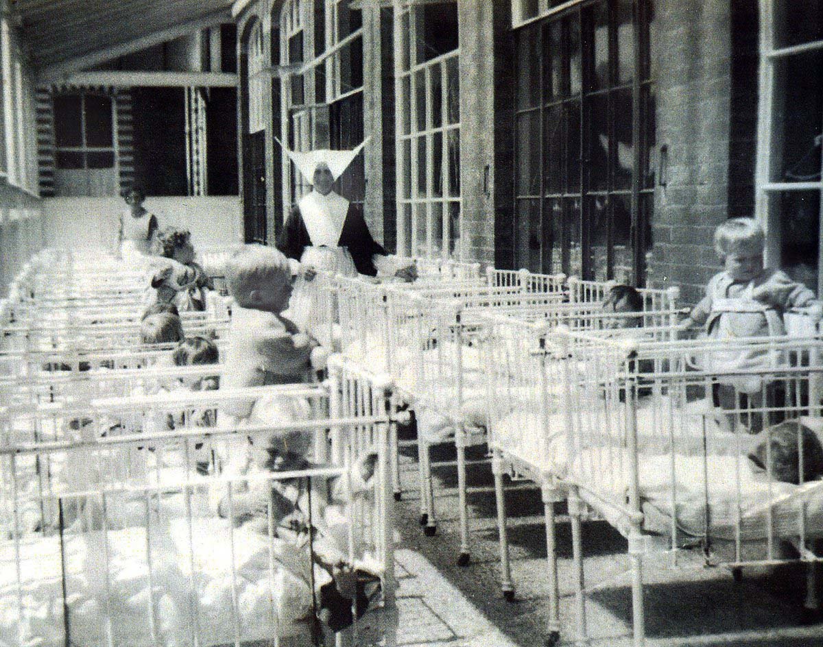 A nun and children at Smyllum orphanage.