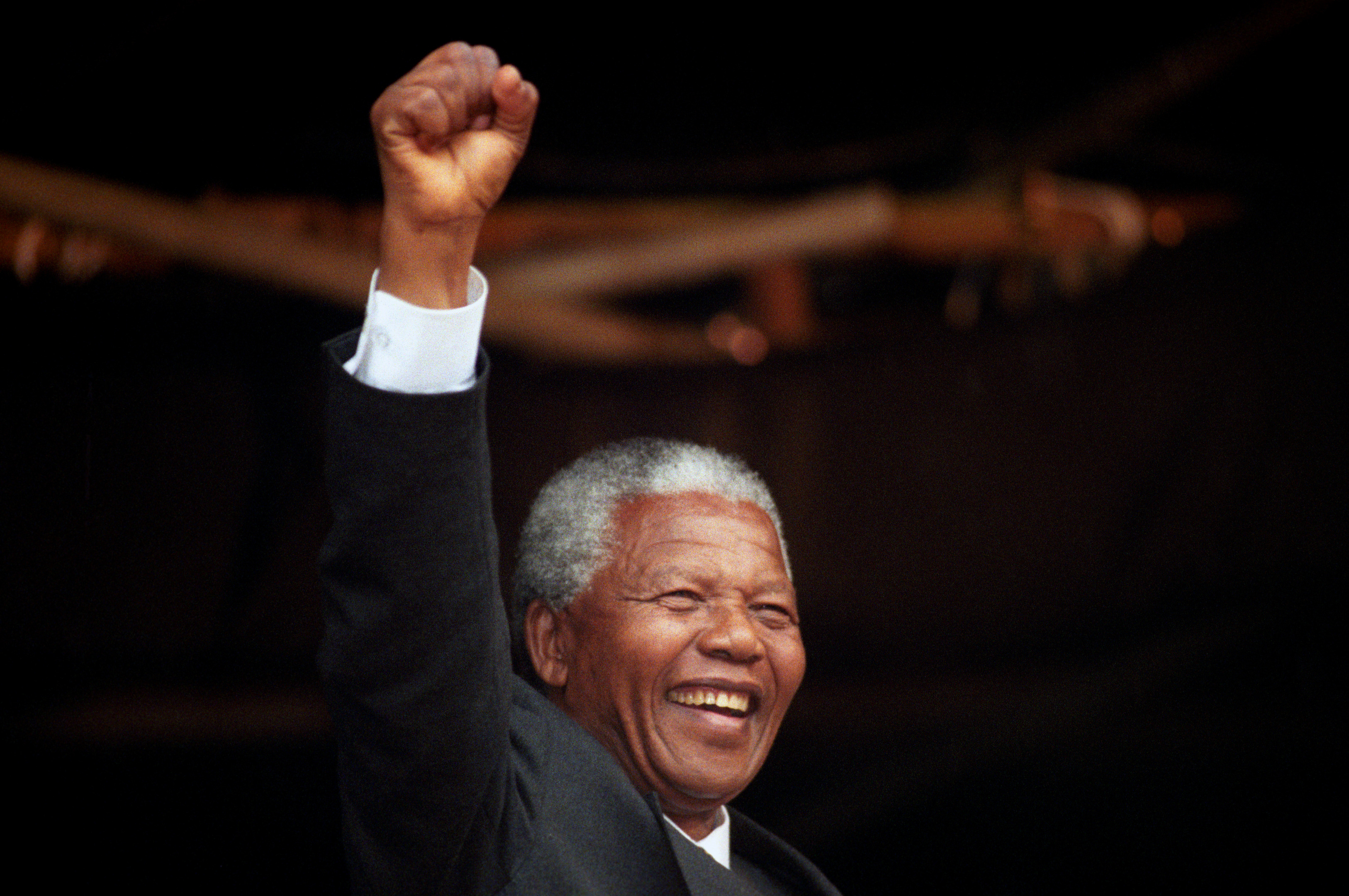 Nelson Mandela acknowledges the crowd in Glasgow, 1993 (PA)
