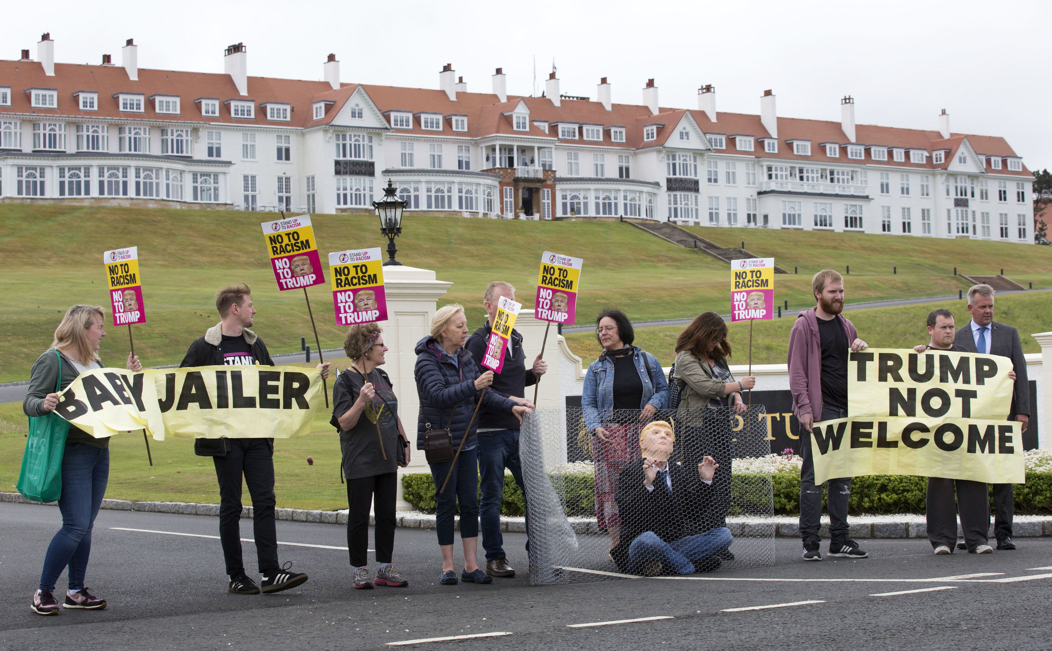 Activists from Stand Up to Racism Scotland (SUTR) stage a protest at the Trump Turnberry resort (David Cheskin/PA Wire)