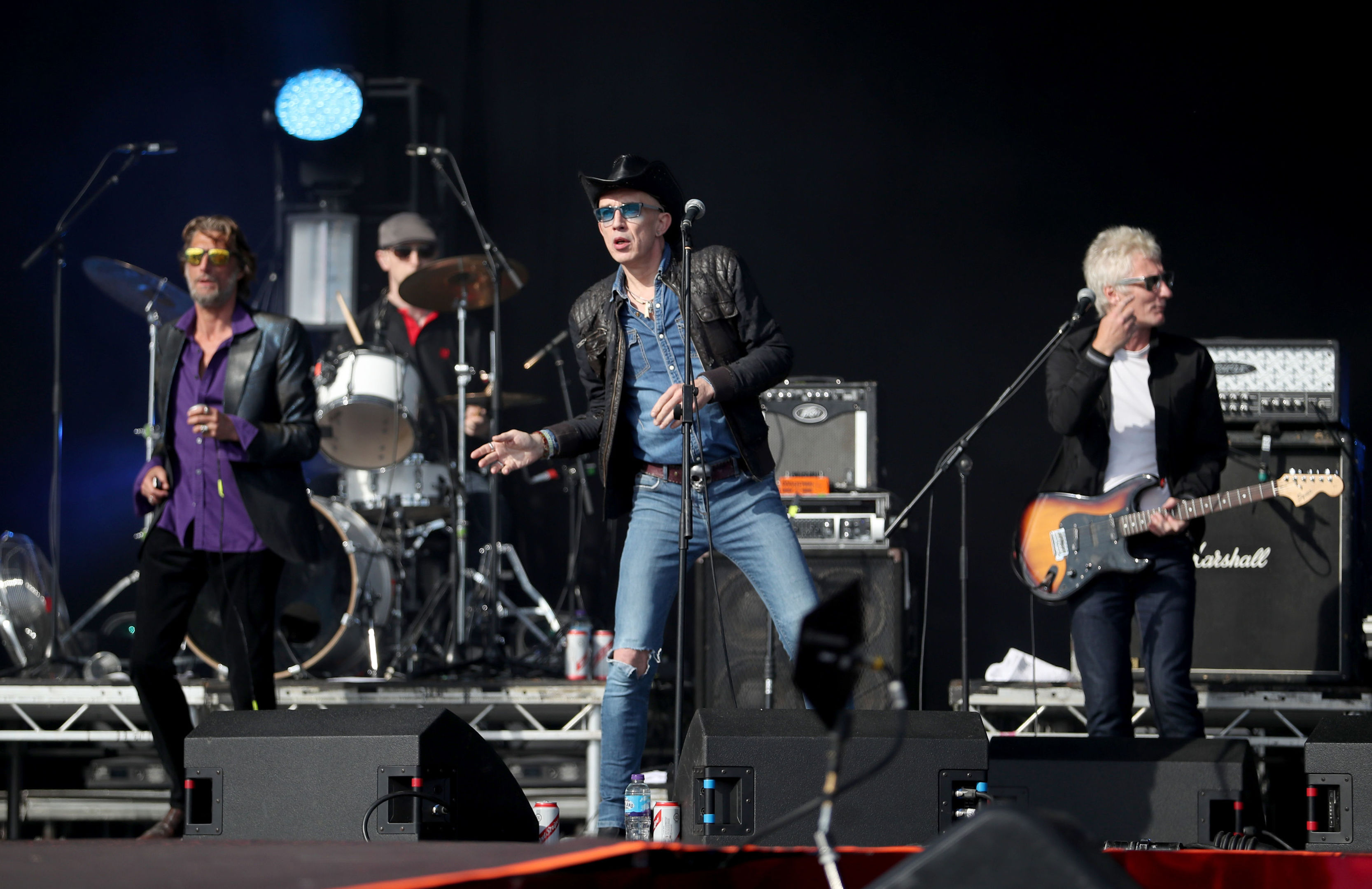 Rob Spragg (centre) performs with his band Alabama 3 on the main stage (Jane Barlow/PA Wire)