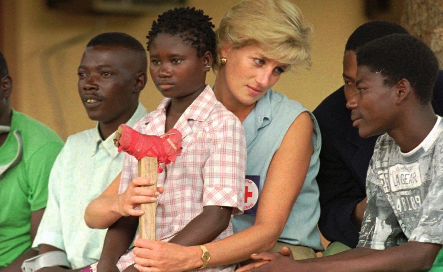 Diana, Princess of Wales, talks to amputees, at the the Neves Bendinha Orthopedic Workshop on the outskirts of Luanda. Joao Silva/AP
