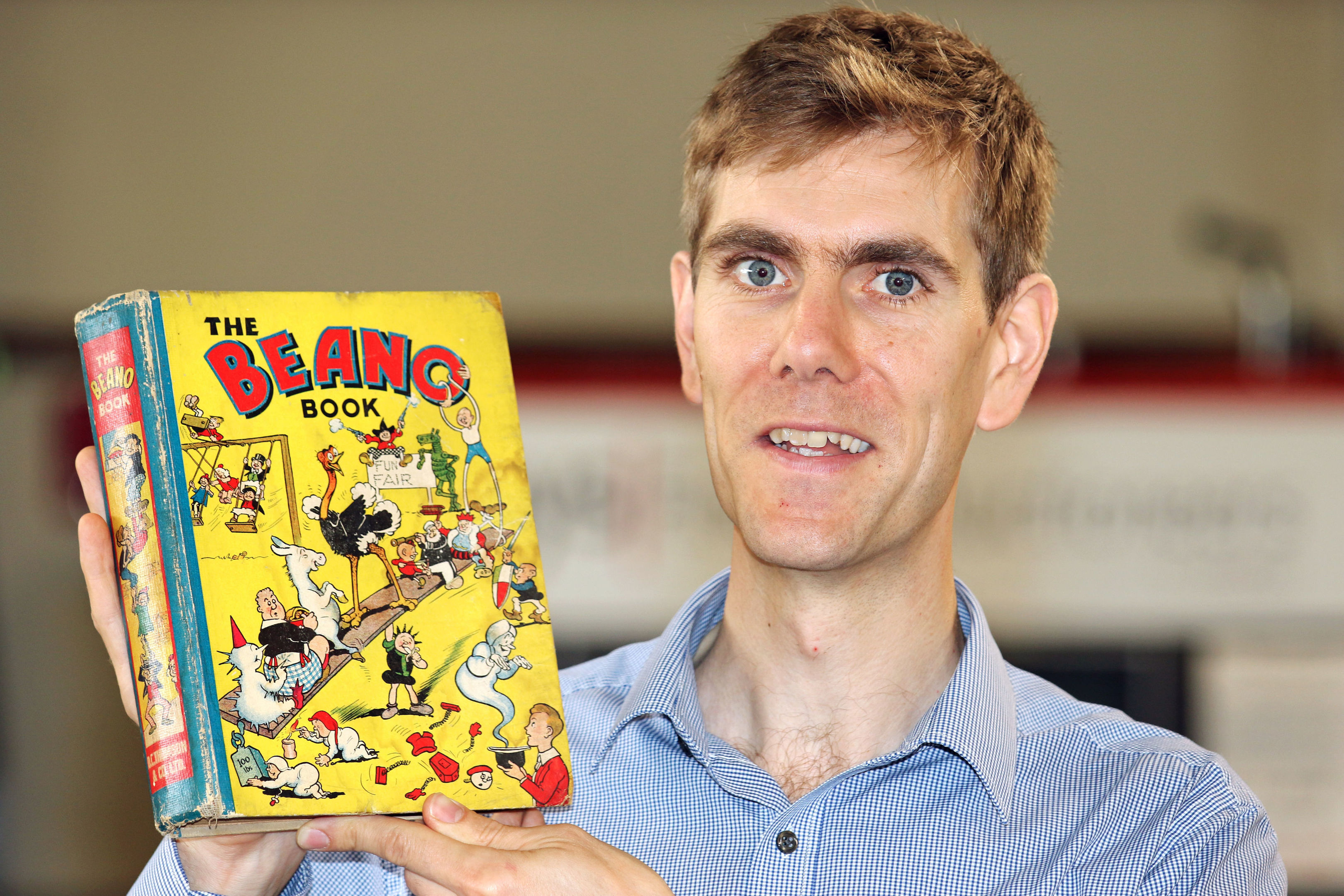Robert Henshilwood, Head of Books at Keys, holding the first ever Beano Annual (Andy Newman/PA Wire)