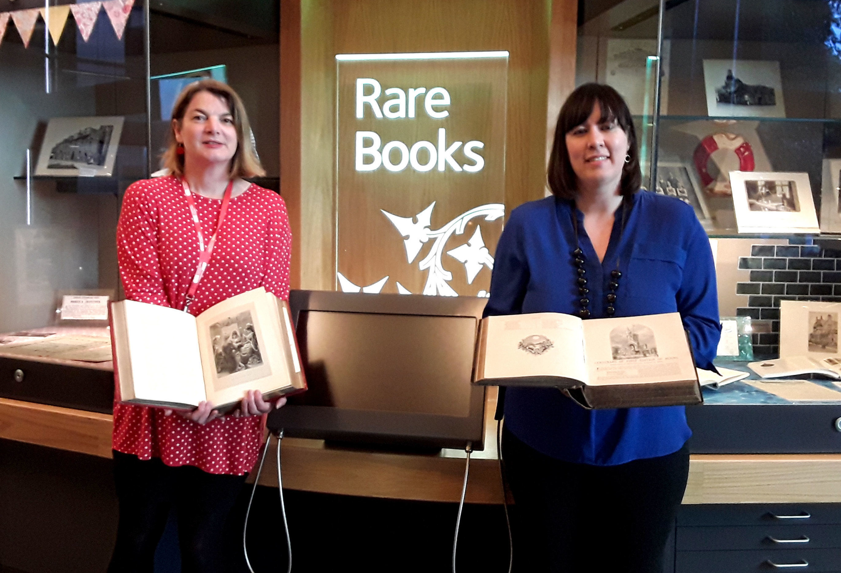 Sara Ann Kelly, Local Studies Officer at ONFife Archive (left) and author Cassie Kennedy holding copies of a historic book on Robert Burns (Fife Council/PA Wire)