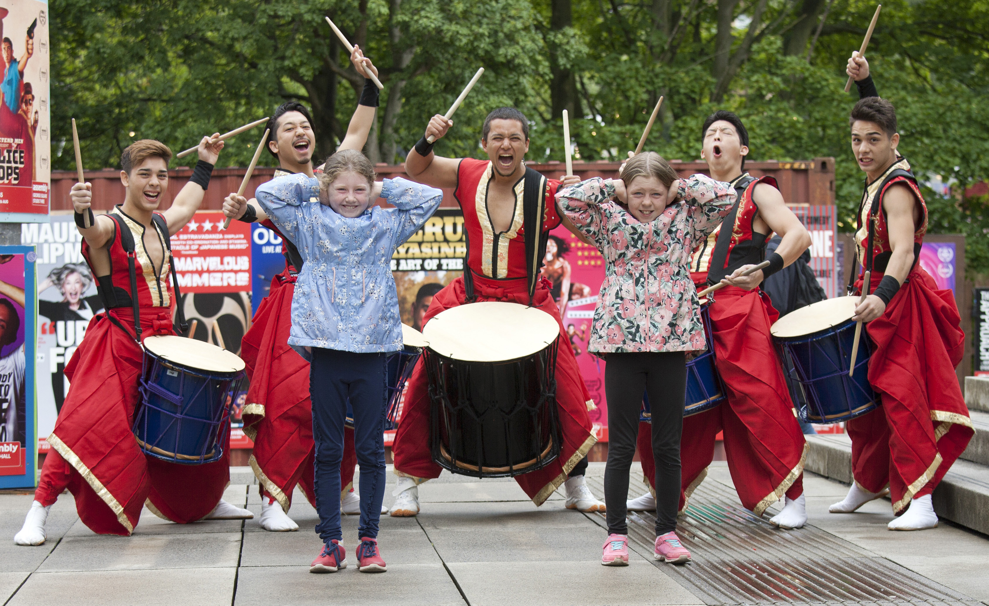 Emily and Holly Chalmers from Musselburgh cover their ears as Japan Marvelous Drummers perform at Edinburgh Festival Fringe (Alistair Linford)