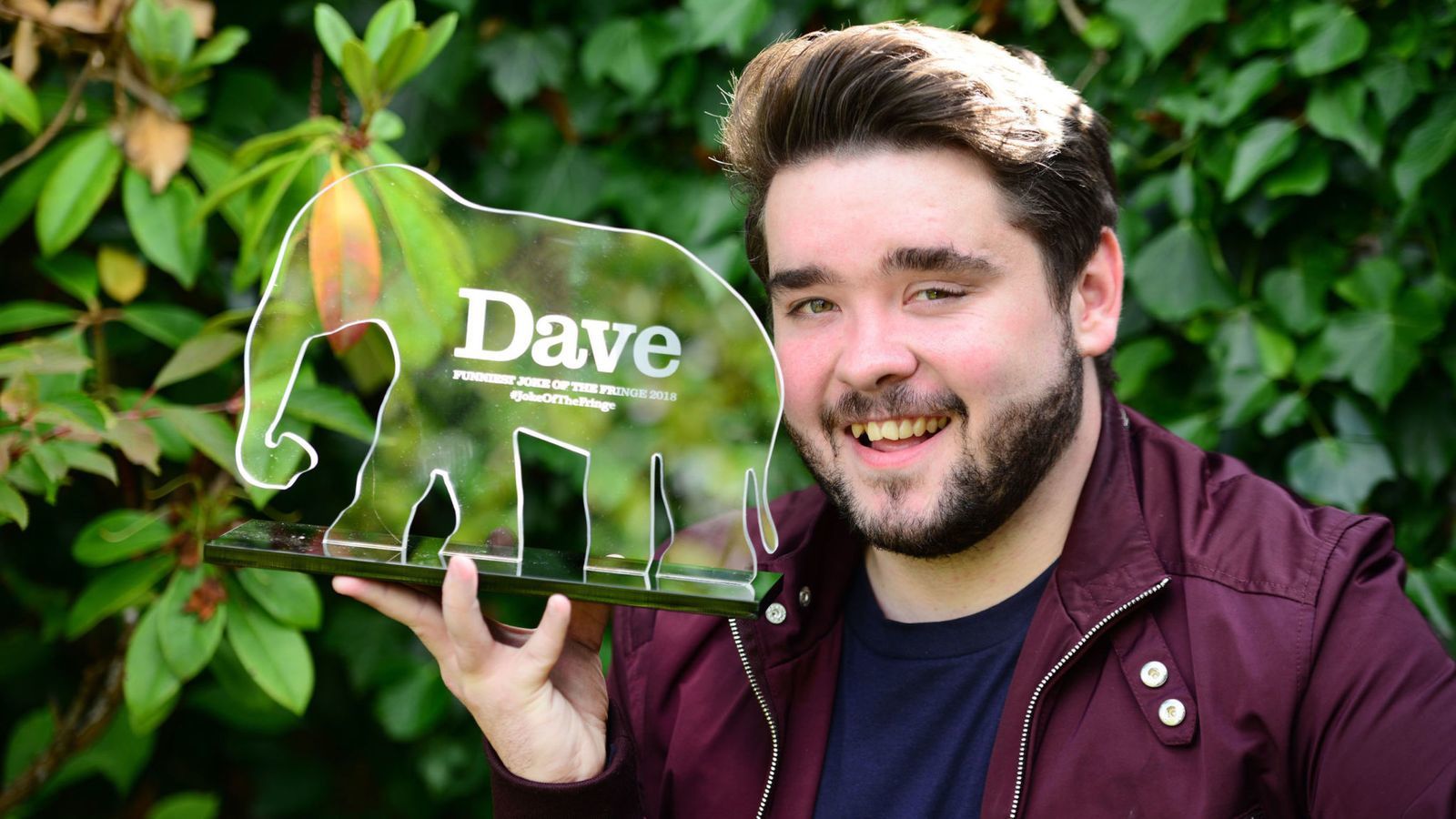Winner Adam Rowe with the 11th Dave’s Funniest Joke of the Fringe Award.