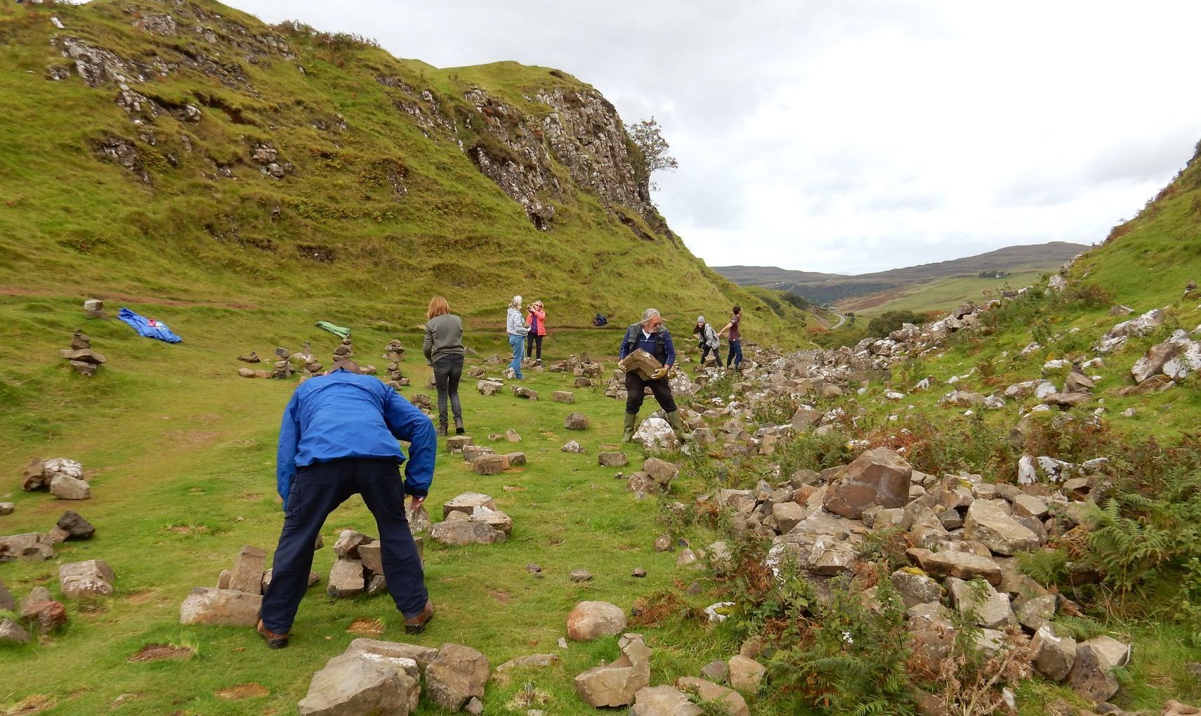 Locals removing the stone stacks left by tourists at the Fairy Glen, Isle of Skye. Staffin, Isle of Skye Facebook page.