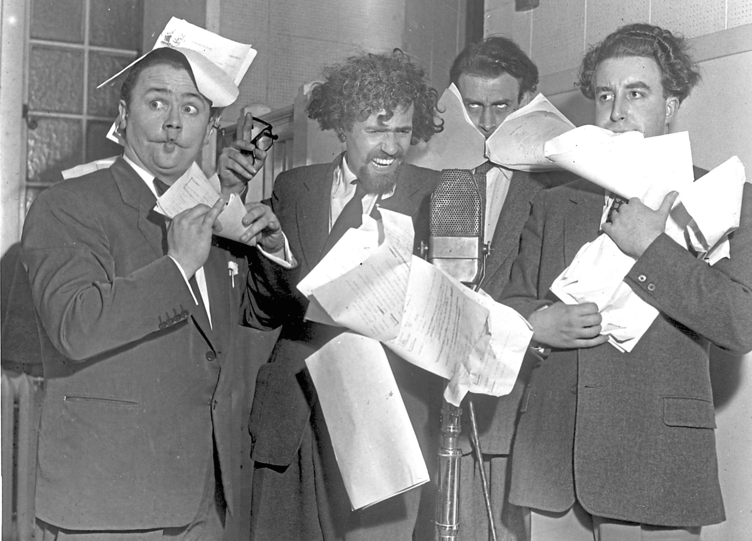 1951: The Goons having problems controlling their scripts. From left: Harry Secombe, Michael Bentine, Spike Milligan and Peter Sellers (Chris Ware/Keystone Features/Getty Images)