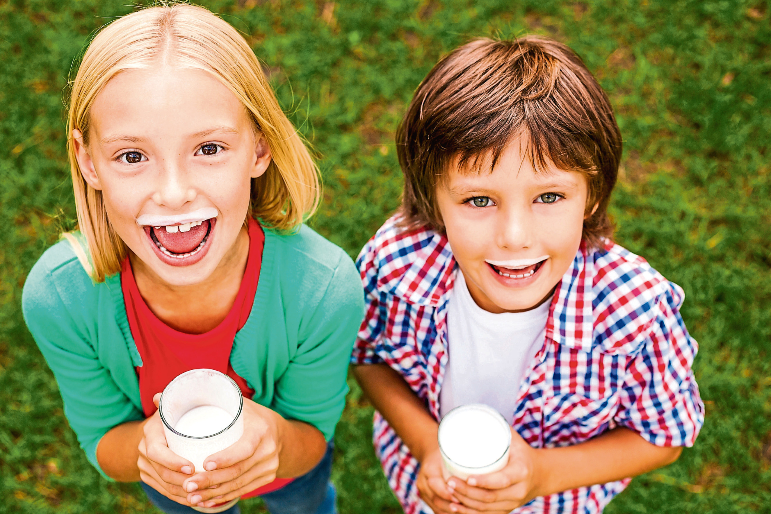 A few gulps of their fave drink gives these two a milk moustache