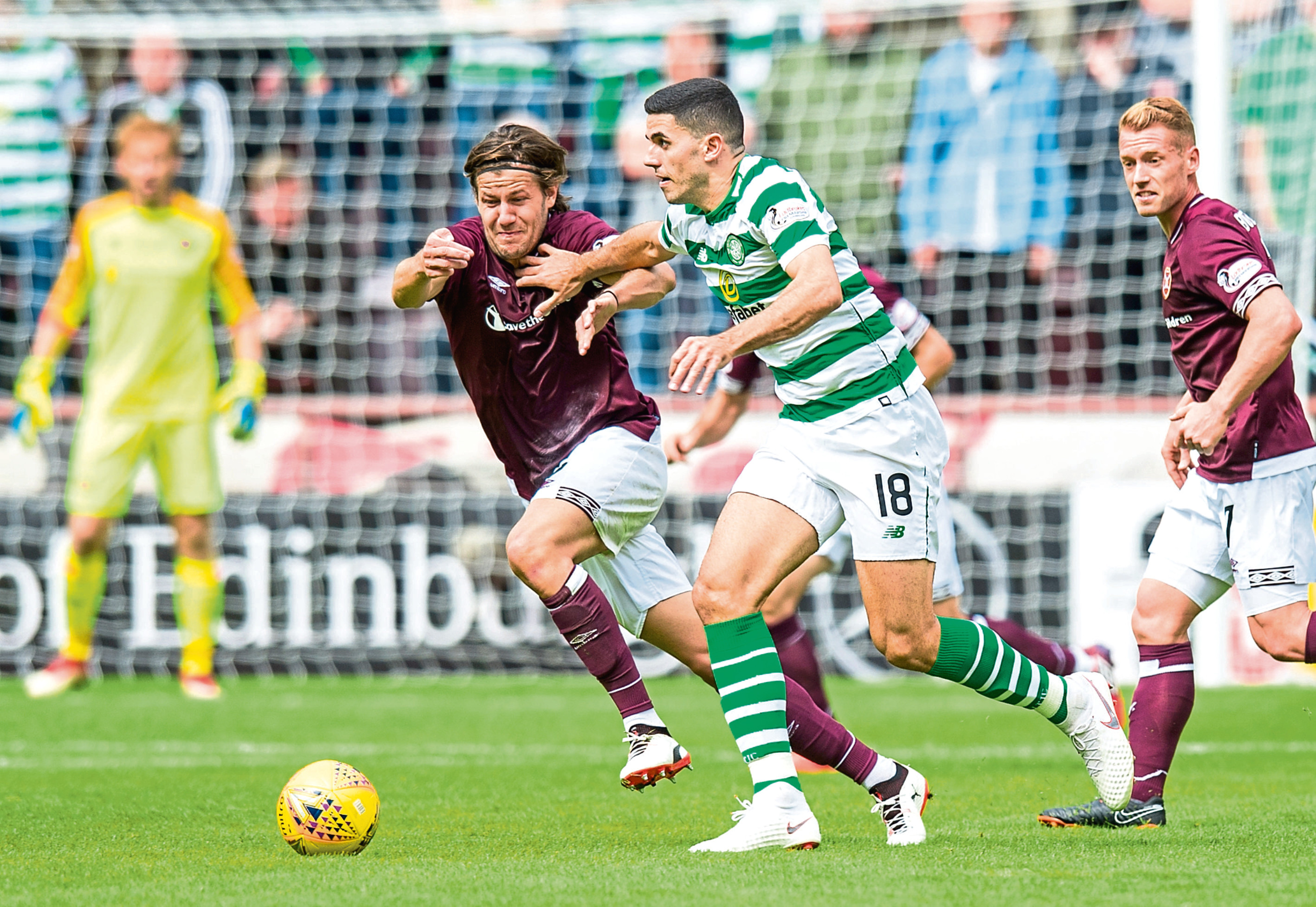 Foreign nationals Peter Haring (Austria) and Tom Rogic (Australia) in action for Hearts and Celtic (SNS Group)
