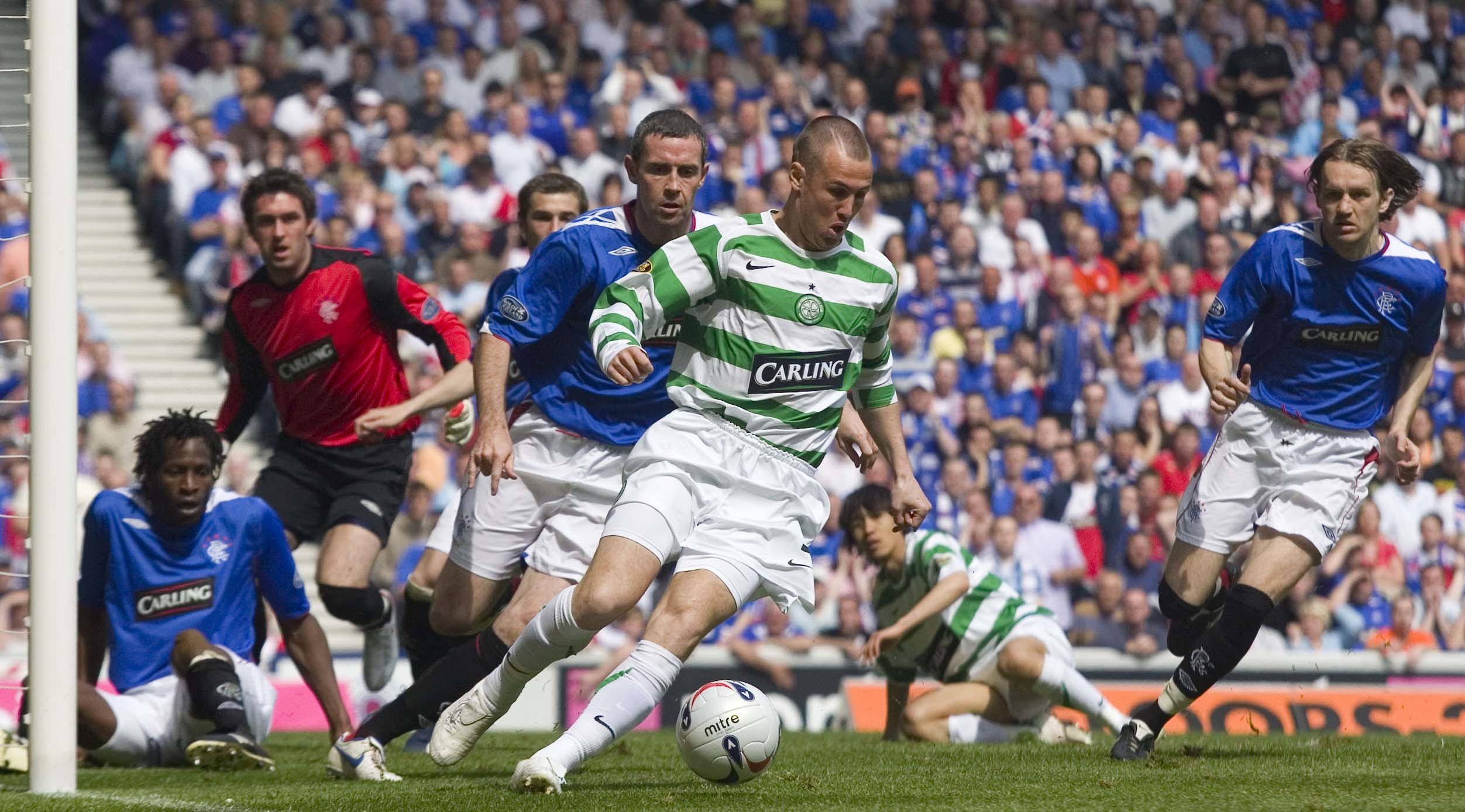 Kenny Miller in action for Celtic against Rangers’ David Weir in 2007 (SNS Group / Aubrey Washington)