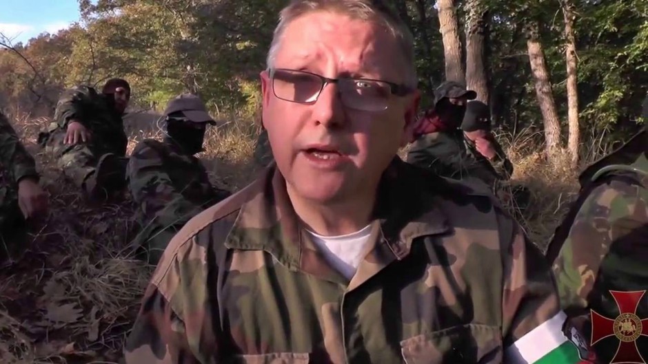 Jim Dowson wearing military fatigues with “migrant hunters” on the Bulgarian-Turkish border in 2016