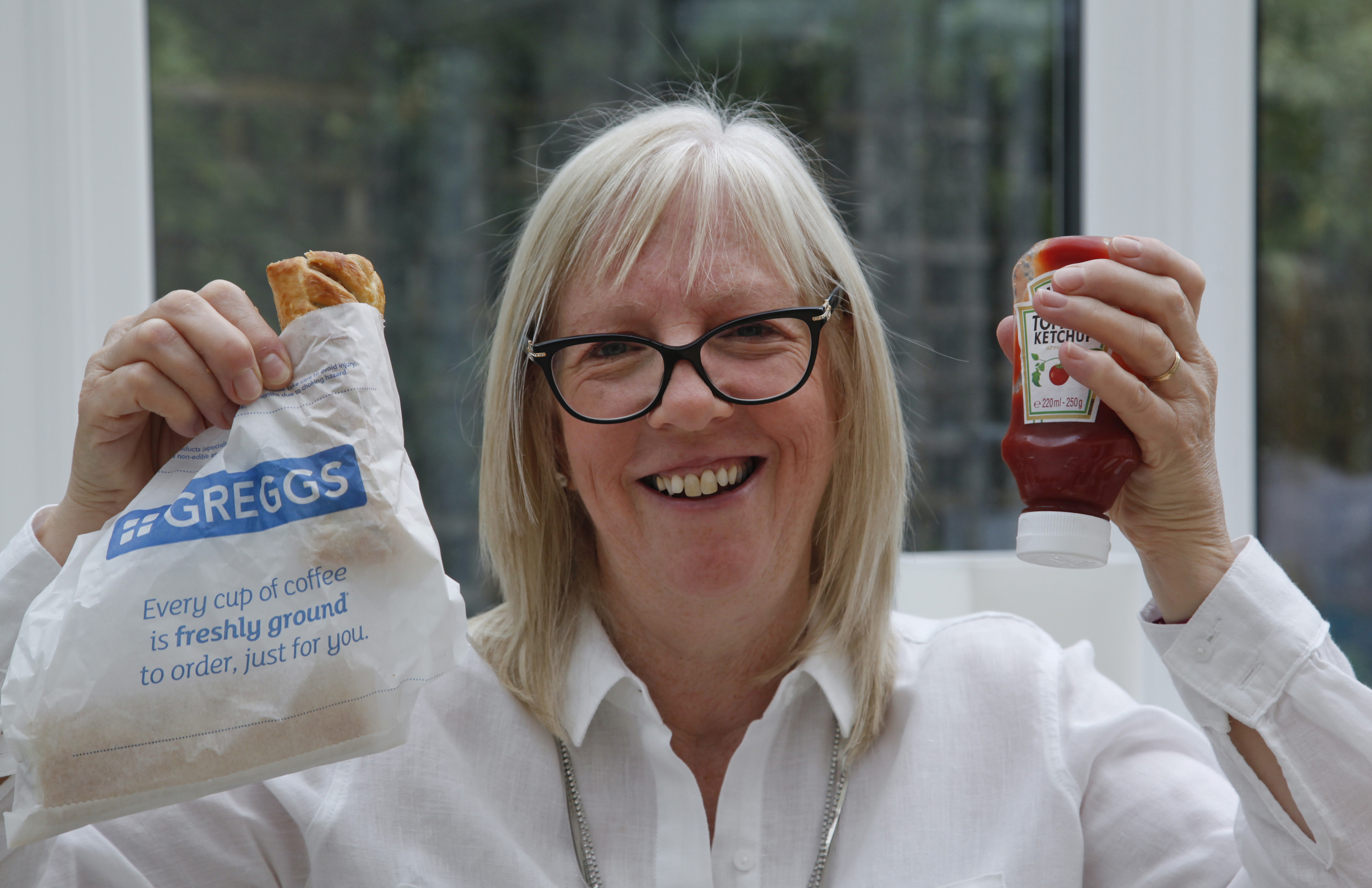 Nicola Wilson with a sausage roll and ketchup, her biggest craving during treatment (Alistair Linford)