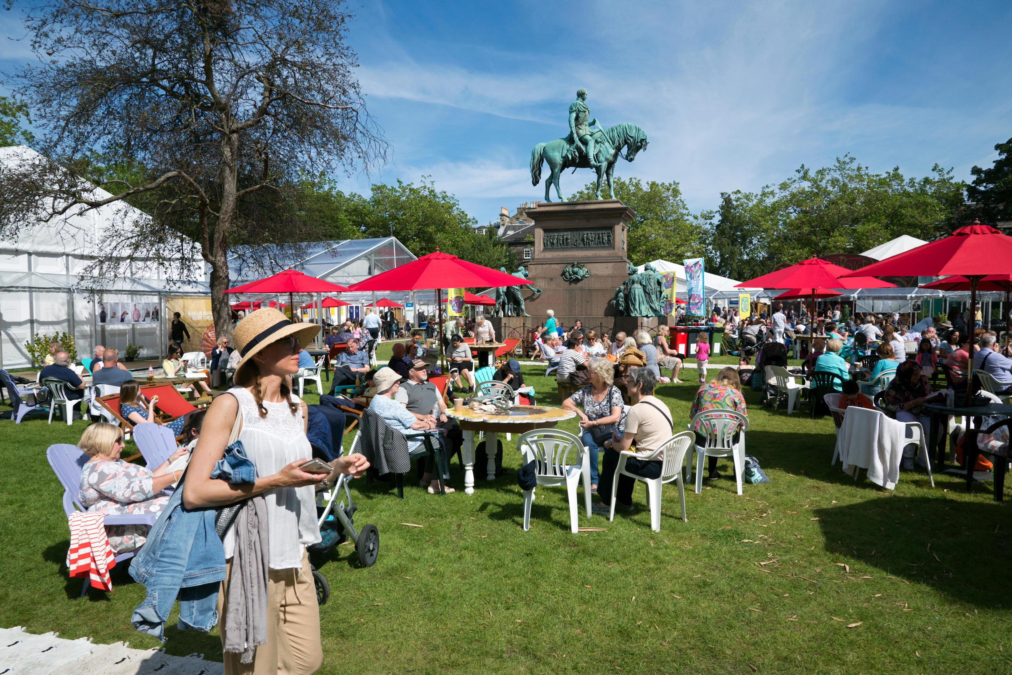 Visitors to the annual Edinburgh Book Festival enjoying the sunshine in Charlotte Square.