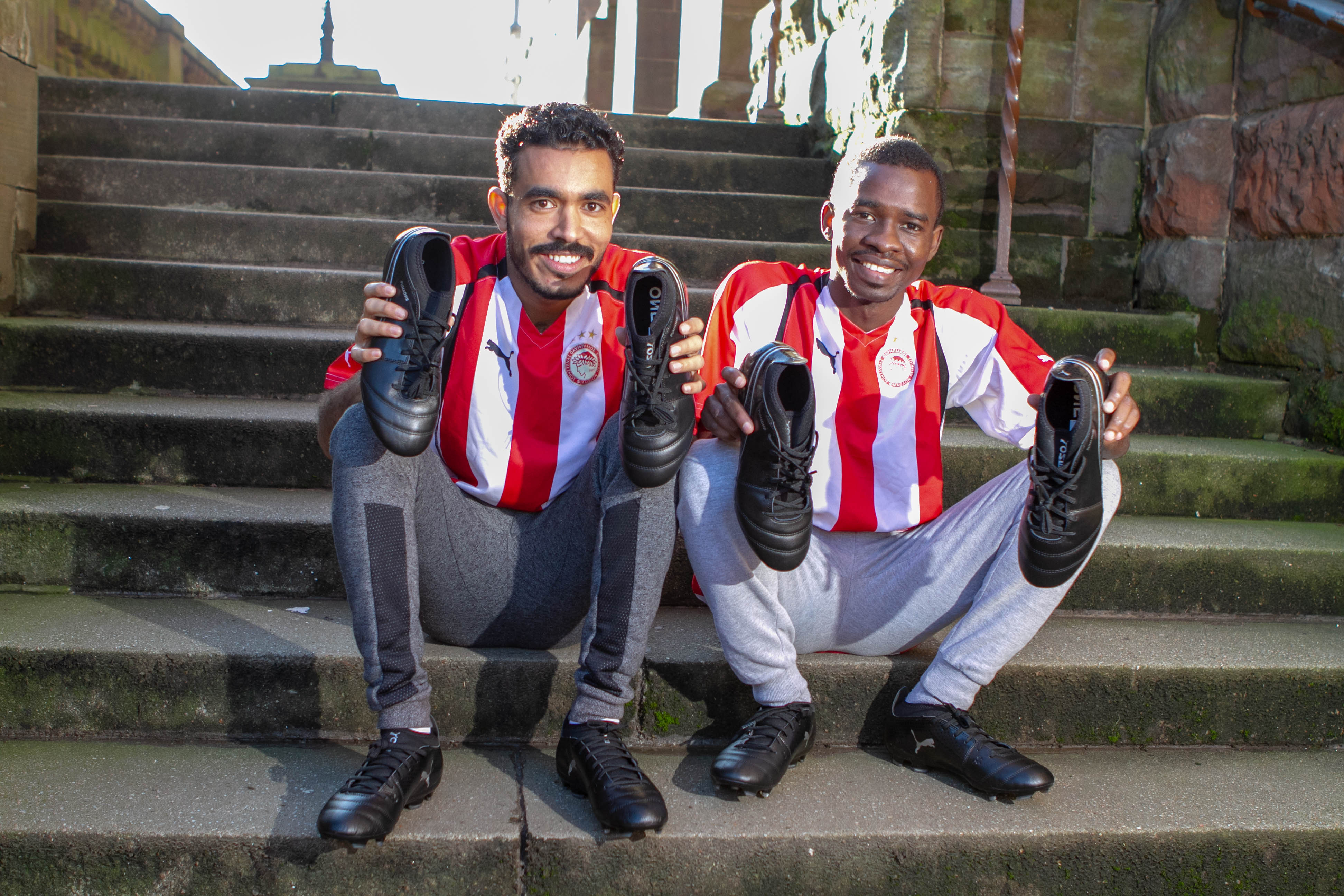 Sudanese footballers Hassim and Tariq with their new boots at St Aloysius’ Church in Glasgow (Chris Austin / DC Thomson)