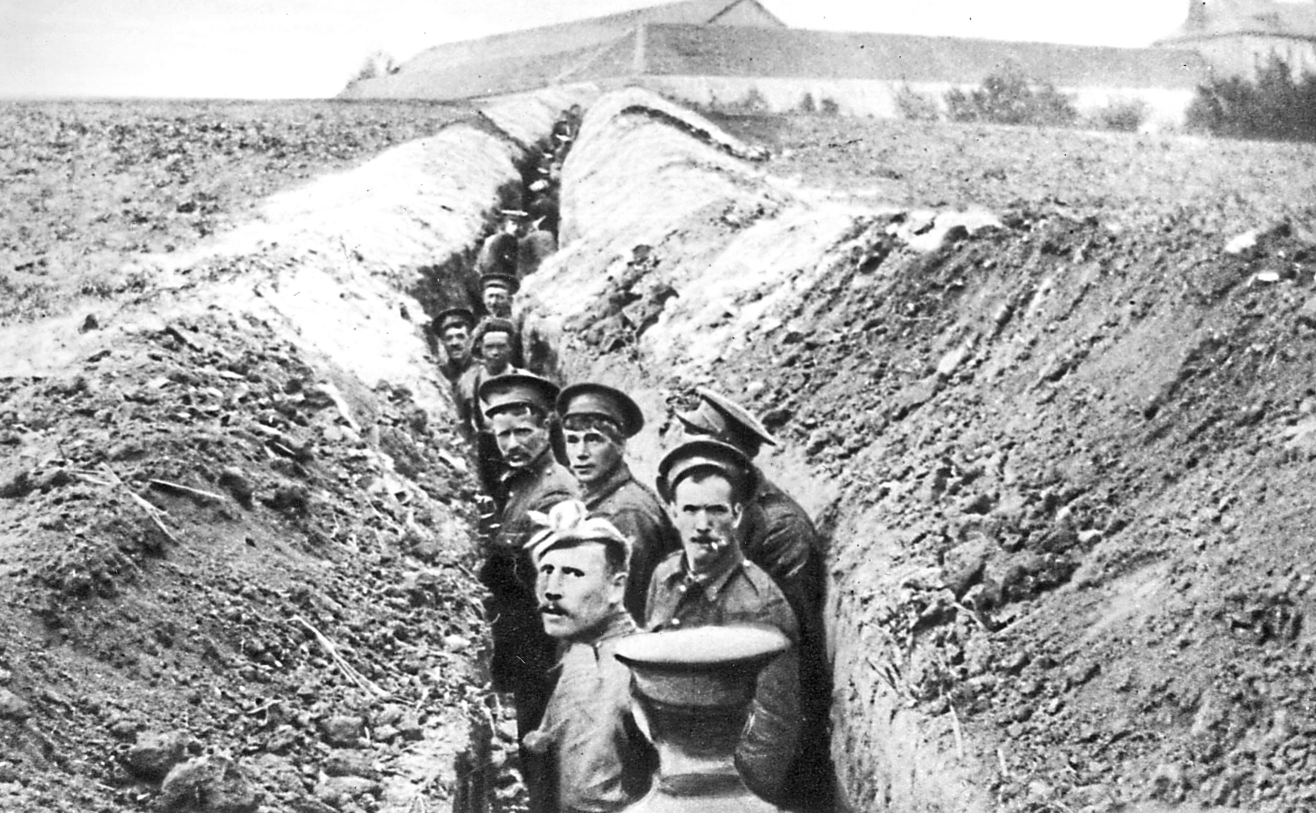 28th October 1914:  British soldiers lined up in a narrow trench during World War I.  (Hulton Archive/Getty Images)