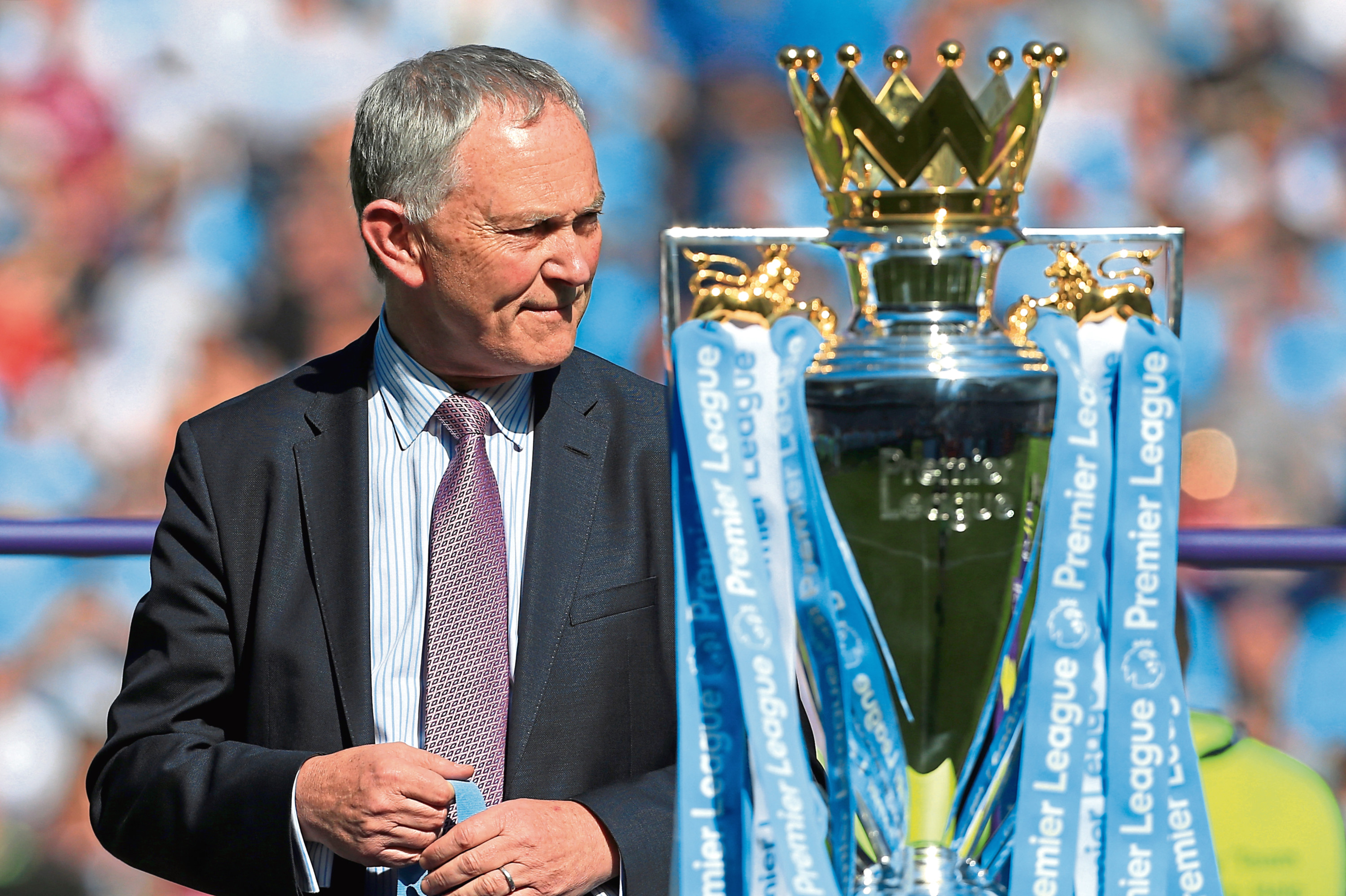 Premier League Chief Executive Richard Scudamore stands alongside the trophy ahead of the presentation after the Premier League match between Manchester City and Huddersfield Town at the Etihad Stadium on May 6, 2018 in Manchester, England. (Simon Stacpoole/Offside/Getty Images)