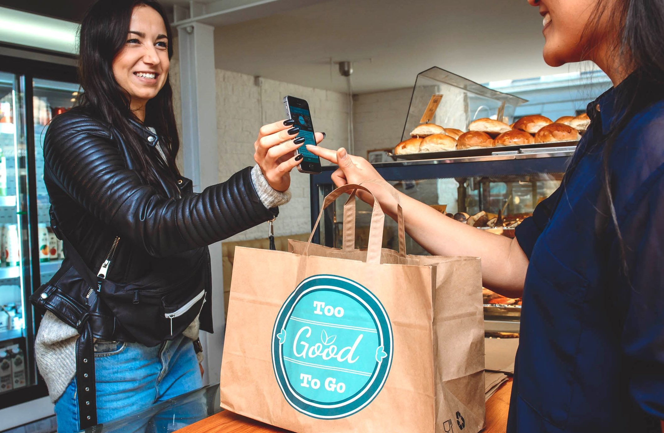 A customer saves food destined for the bin with the Too Good To Go app. (Too Good To Go)