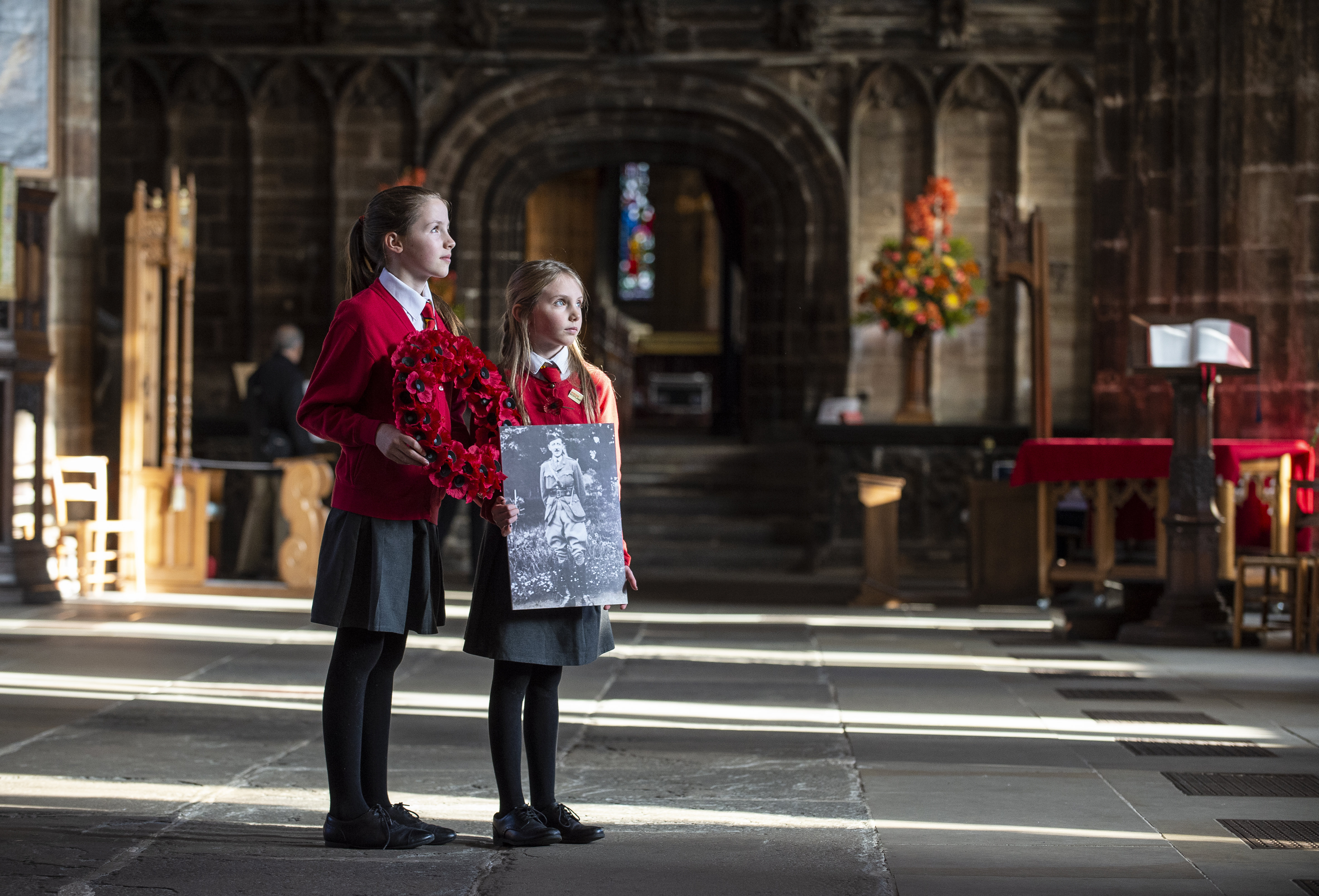 Iona, left, and Torrin Scott-Elliot with a picture of their great-great grandfather Bertie Anderson (Lenny Warren / Warren Media)