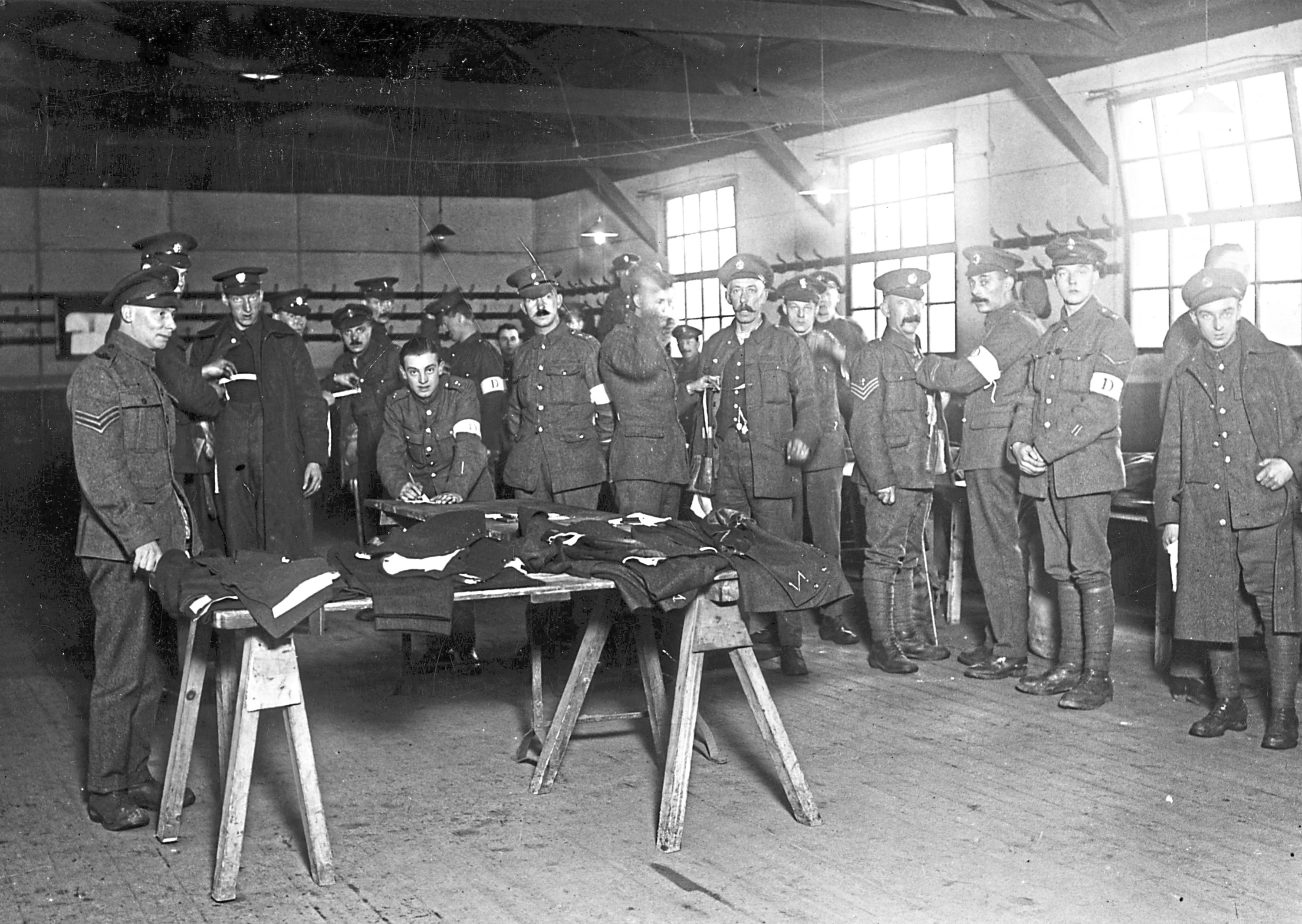 December 1918:  British soldiers being measured for their demob suits at Wimbledon (Topical Press Agency/Getty Images)