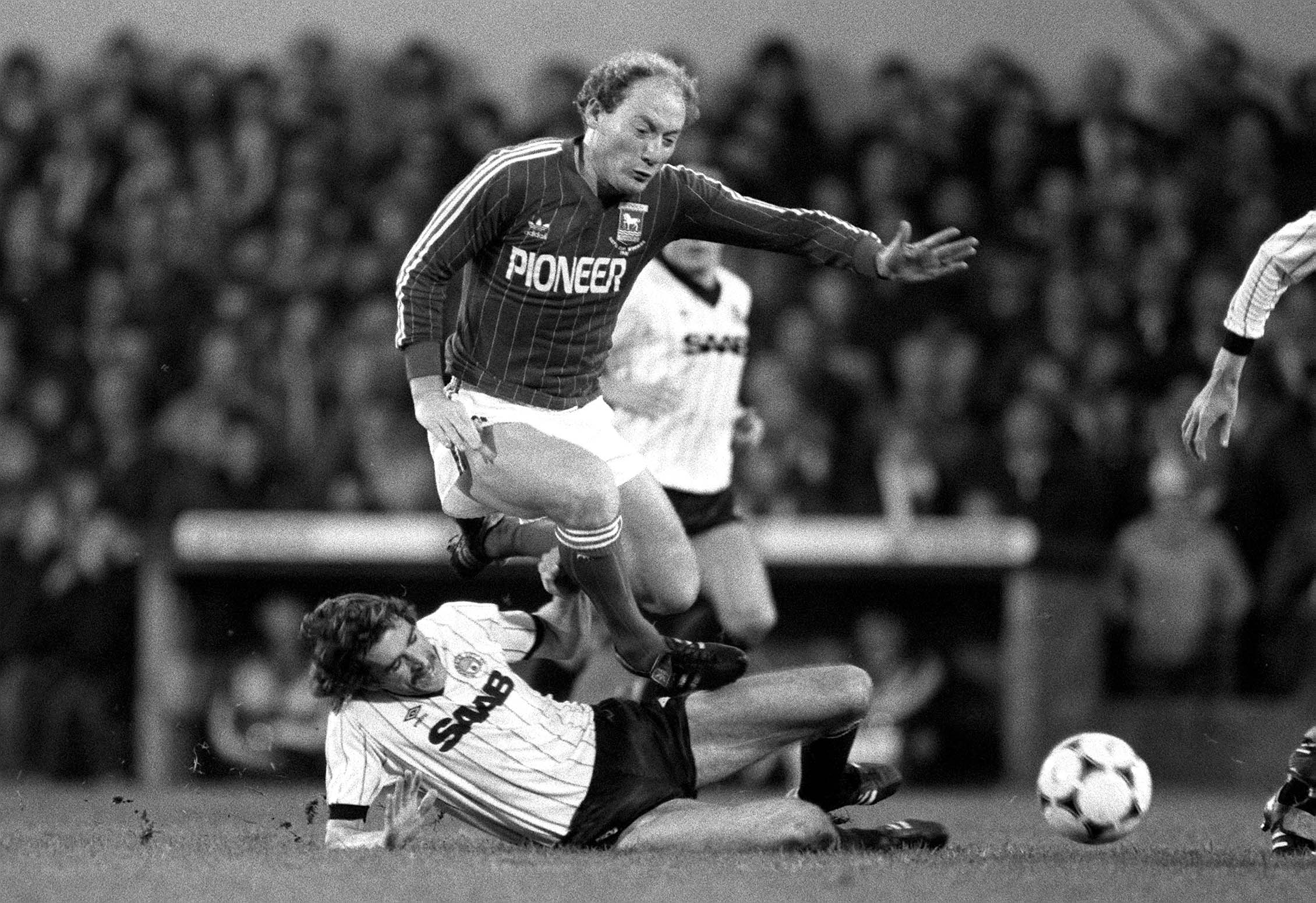 Alan Brazil feels the full force of this tackle by Manchester City’s Paul Power in 1982. (Mark Leech/Getty Images)