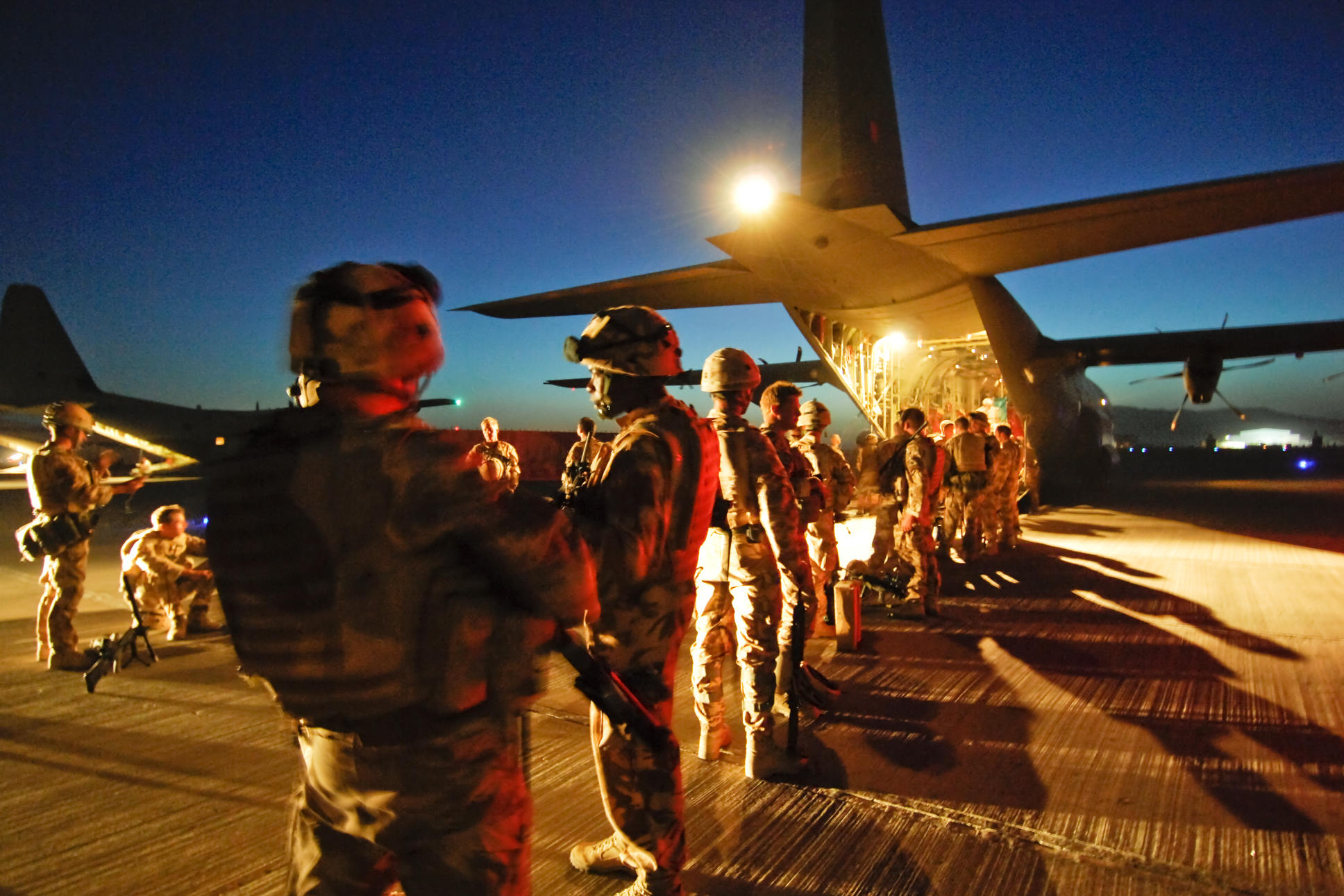 Troops from 3 Scots, The Black Watch prepare to board a Royal Air Force Hercules C130J aircraft at Kandahar Airfield, Afghanistan.