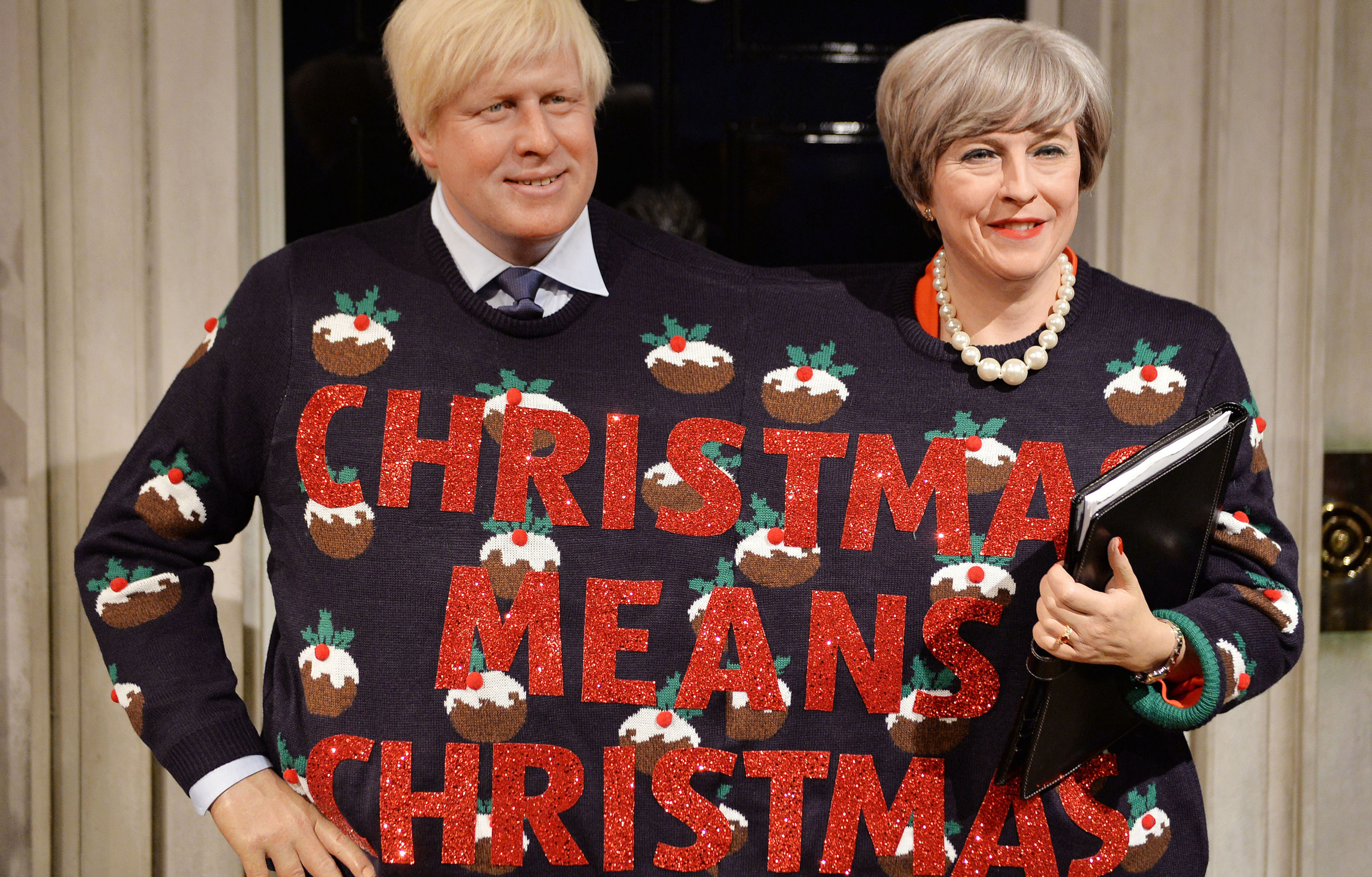 Waxwork Boris and Theresa share the Christmas spirit (John Stillwell/PA Wire)