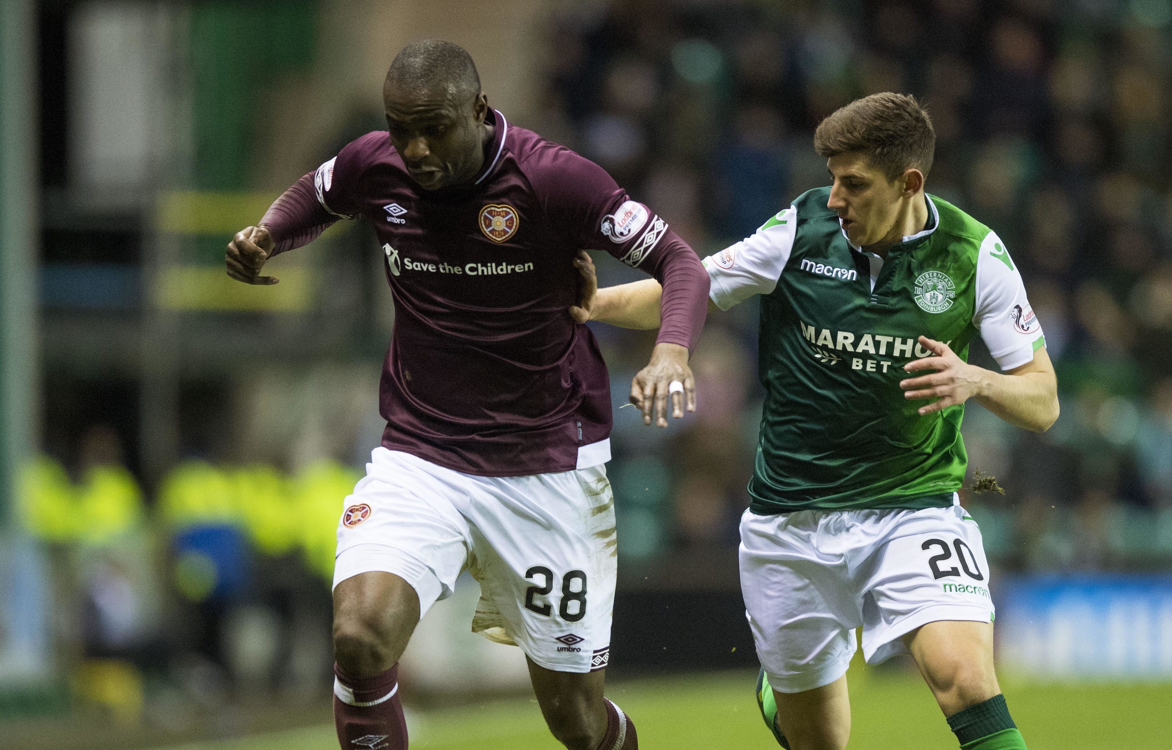 Hearts' Clevid Dikamona (L) in action with Hibernian's Emerson Hyndman (SNS Group)