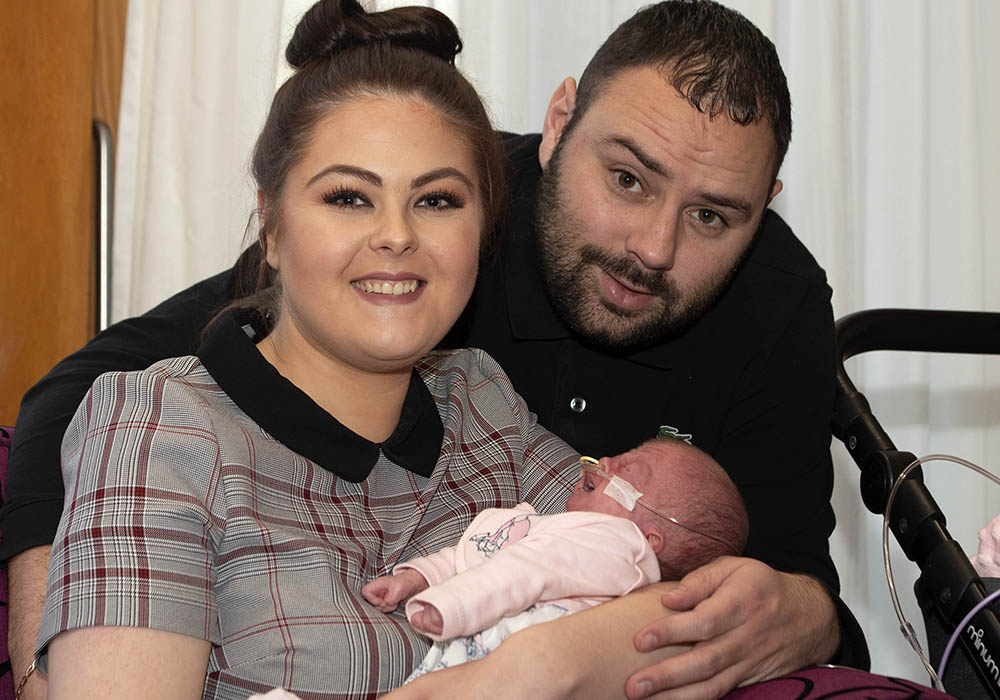 Isla Limbert with partner Stephen Martin and five-week-old baby Callie-Rose at CHAS Christmas party at Robin House