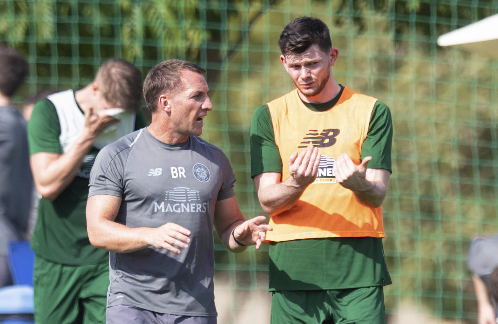 Celtic manager Brendan Rodgers (L) and Oliver Burke.