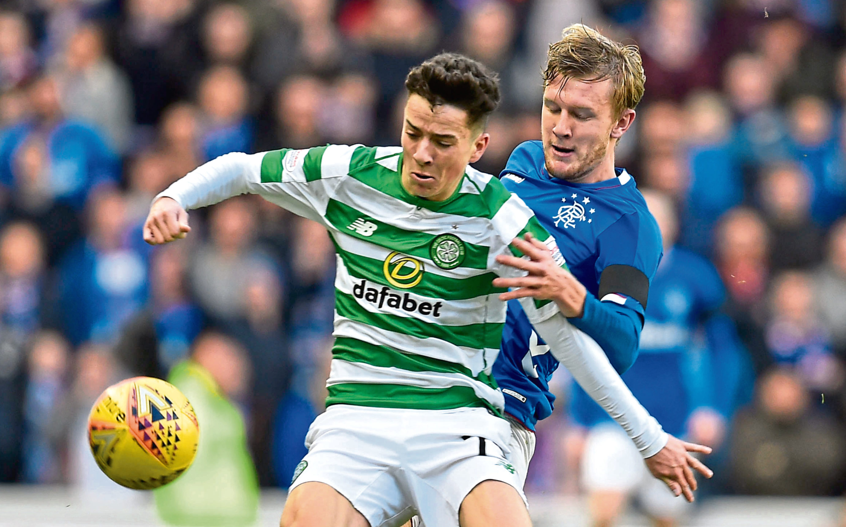 Celtic's Mikey Johnston (left) holds off Rangers' Joe Worrall (SNS Group)