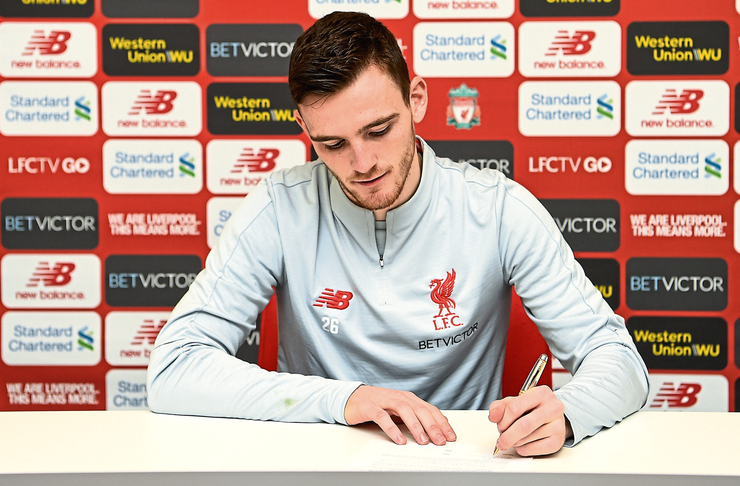 Andy Robertson signs a contract extension (Andrew Powell / Liverpool FC via Getty Images)