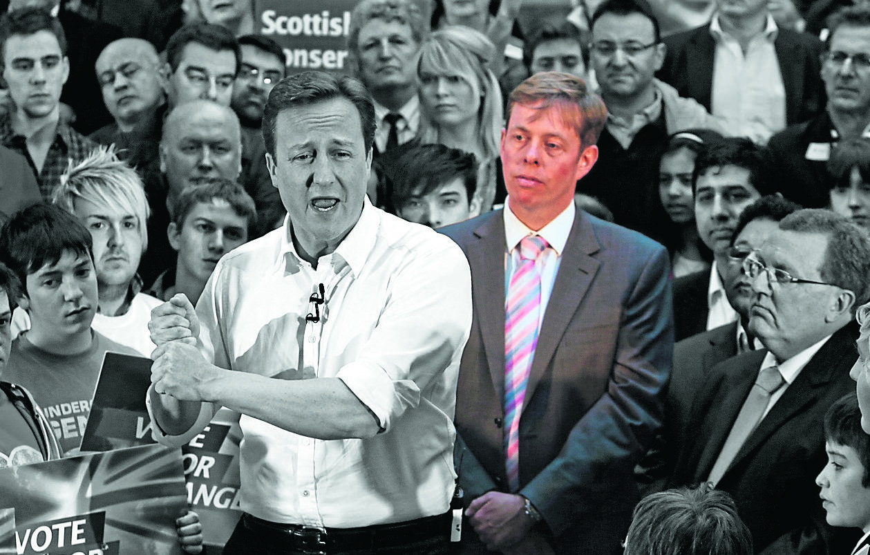 Prime Minister David Cameron backs then-Tory candidate Richard Cook, in colour, on a campaign visit to Scotland in 2010