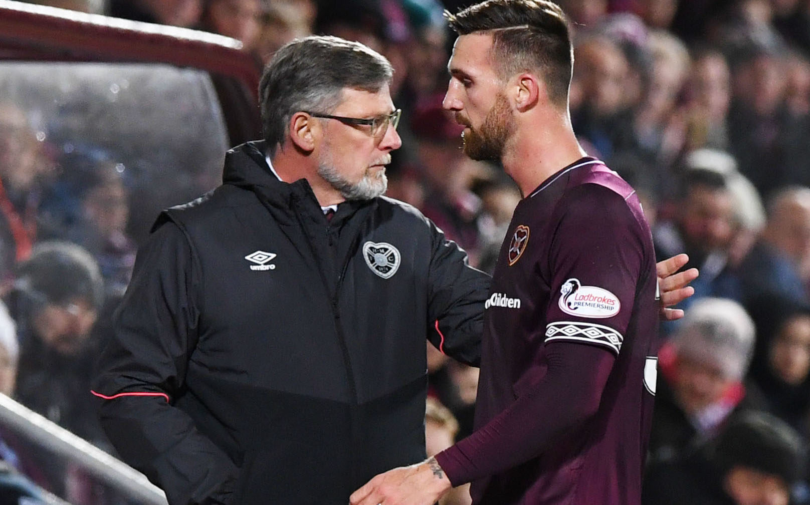 Hearts' David Vanecek walks past manager Craig Levein after being substituted in the first half (SNS Group)