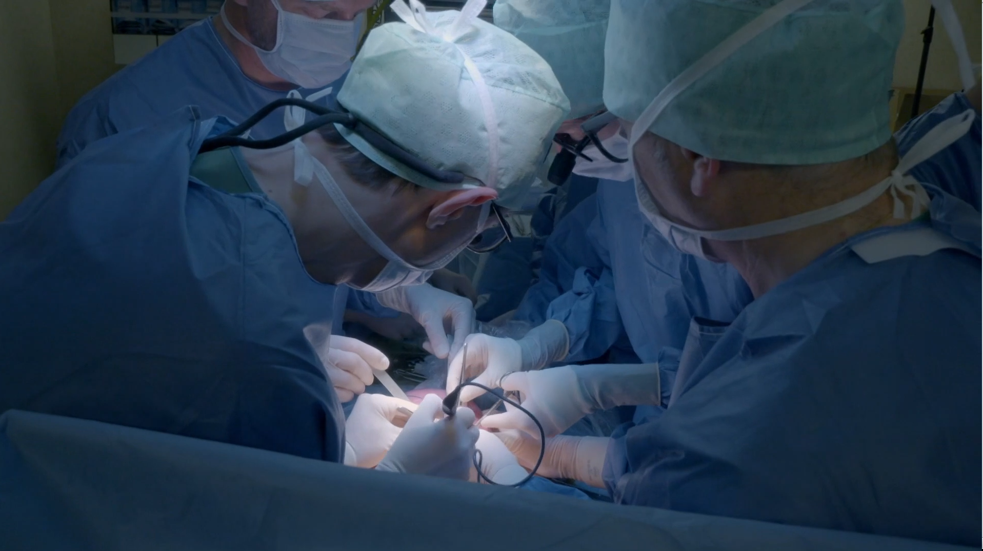 Dominic Thompson operating on an unborn baby in Belgium under the supervision of leading foetal surgeon Professor Jan Deprest