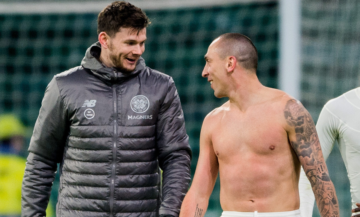 Celtic captain Scott Brown (right) with Oliver Burke at full time