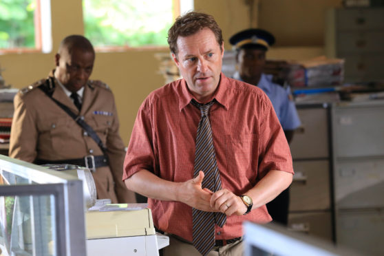 Ardal O'Hanlon as detective Jack Mooney in Death In Paradise