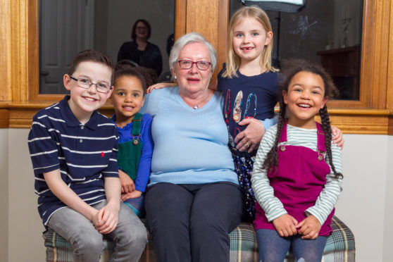 Maggie Clayton with her grandkids that she likes to give sweets and juice.