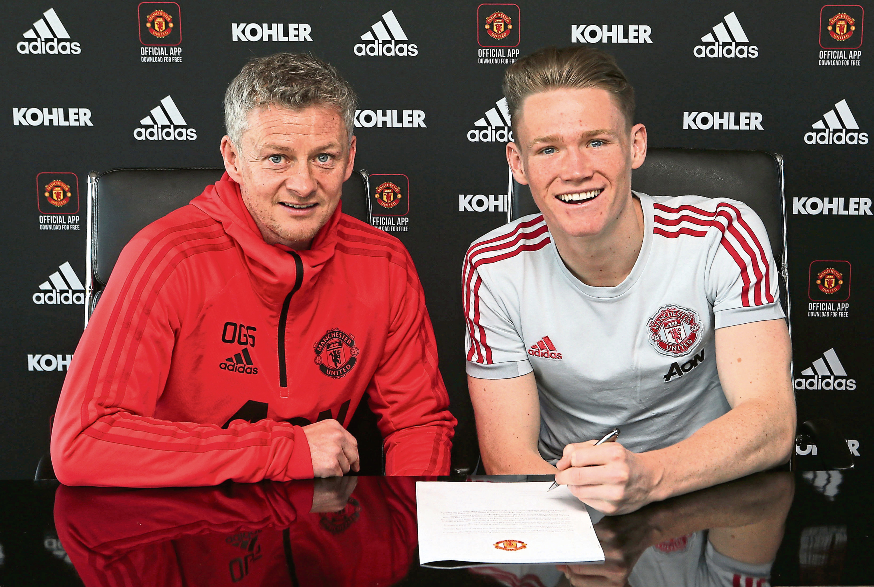 x
MANCHESTER, ENGLAND - JANUARY 21: (EXCLUSIVE COVERAGE)  Scott McTominay of Manchester United poses after signing a contract extension with the club at Aon Training Complex on January 21, 2019 in Manchester, England. (Tom Purslow/Man Utd via Getty Images)