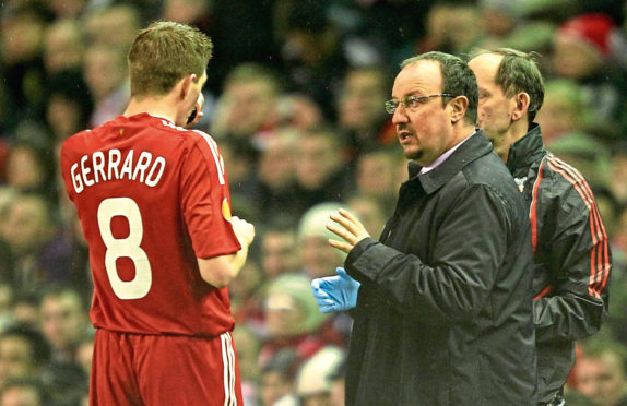 Steven Gerrard is given instructions by Rafael Benitez in 2010