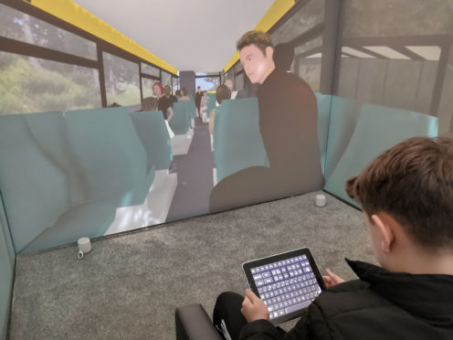 A child operating the Blue Room, a virtual reality suite that allows specialists to create a safe environment for children with autism to work their way through scenarios and confront their fears with the help of a therapist