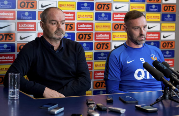 Kilmarnock manager Steve Clarke (L) and Kris Boyd speak to the media following incidents of sectarian abuse in the past week