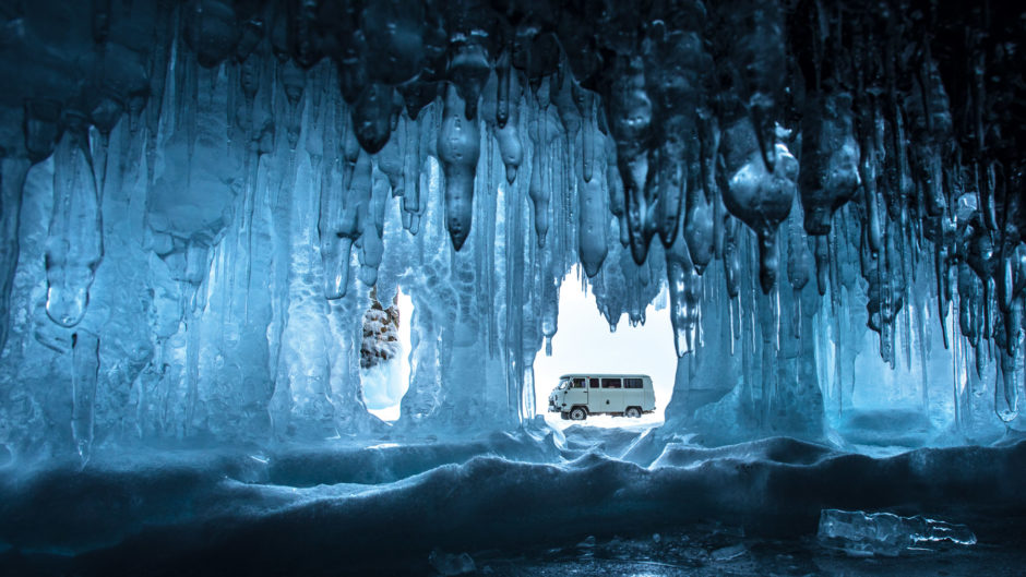 Spirit of Travel – Runner-up Peter Racz (Hungary) Lake Baikal, Siberia, Russia There are many ice caves on the shore of Lake Baikal and I took this picture from inside one of them. I was lying on the ice, trying to frame the vehicle perfectly in the gap in the ice. The cave looks far bigger in the image due to the use of the wideangle lens.